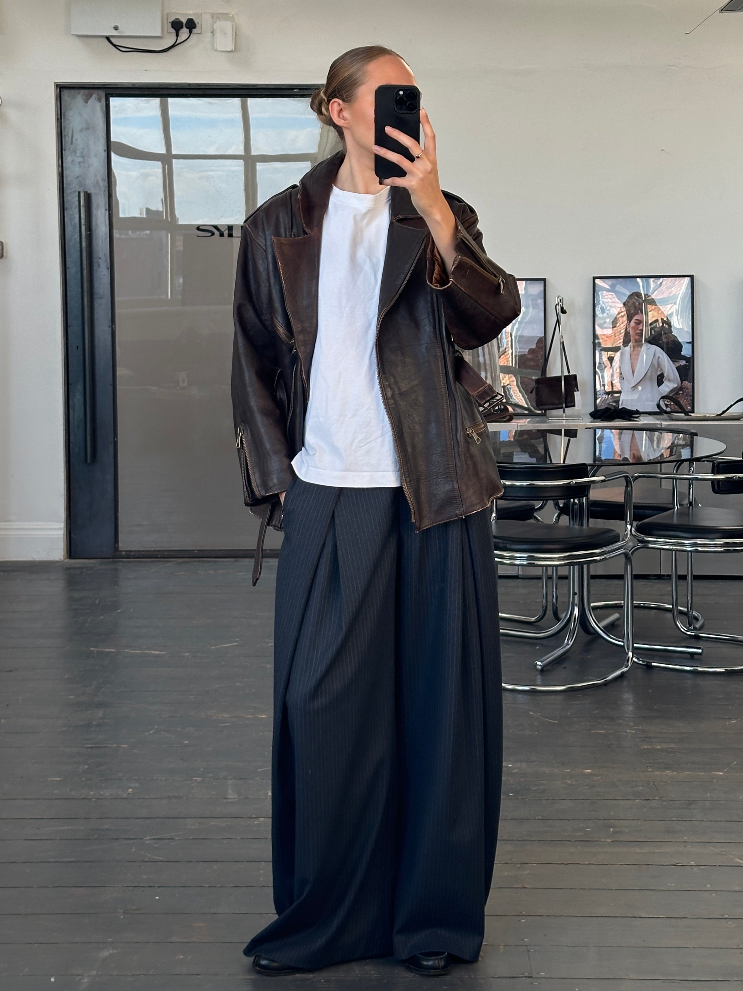 Vintage Italian 1990s aged leather belted jacket, size M, with classic distressed look and detailed stitching.