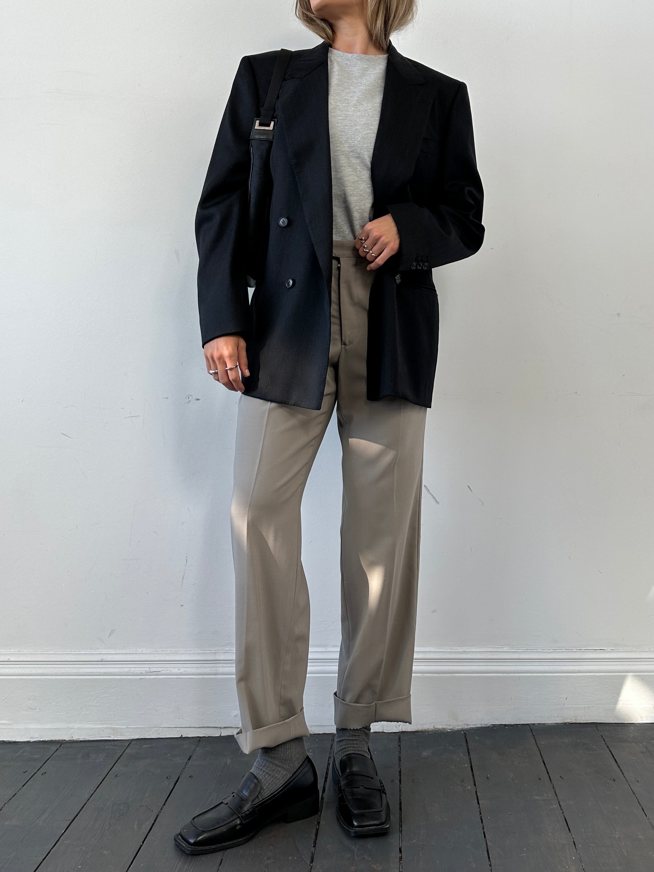 Pal Zileri oversized double-breasted blazer with wide lapels, tailored fit, in a neutral fabric, displayed on a hanger.