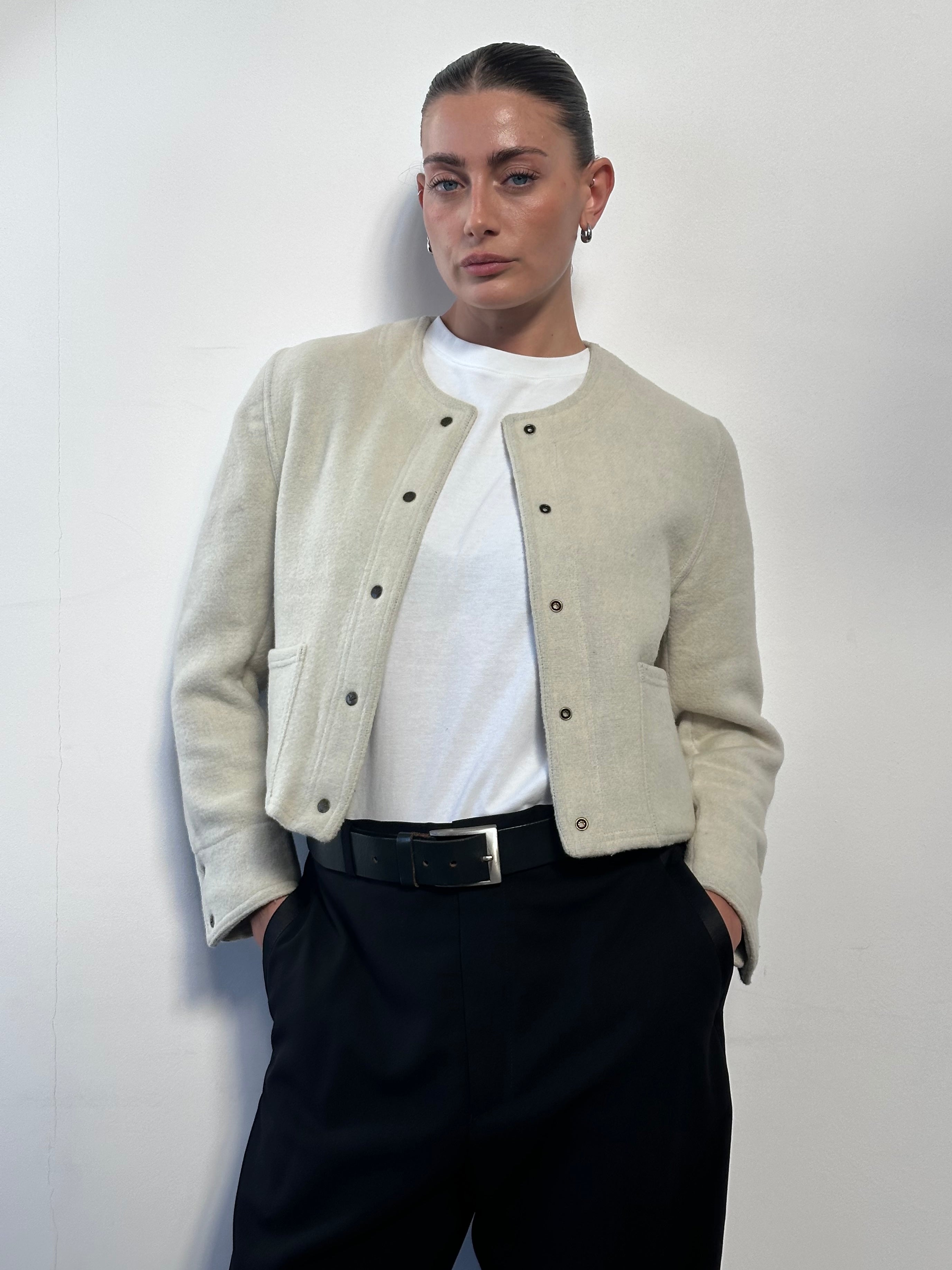 Vintage Italian vintage wool tailored jacket in size S, featuring classic design and craftsmanship, displayed on a hanger.