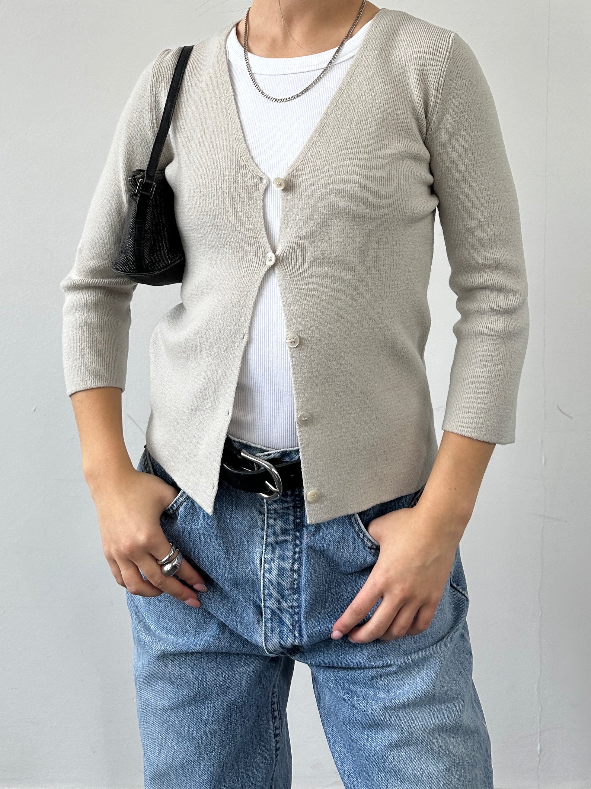 Emporio Armani merino wool cardigan in XXS/XS, featuring a classic knit design and button closure, displayed on a hanger.