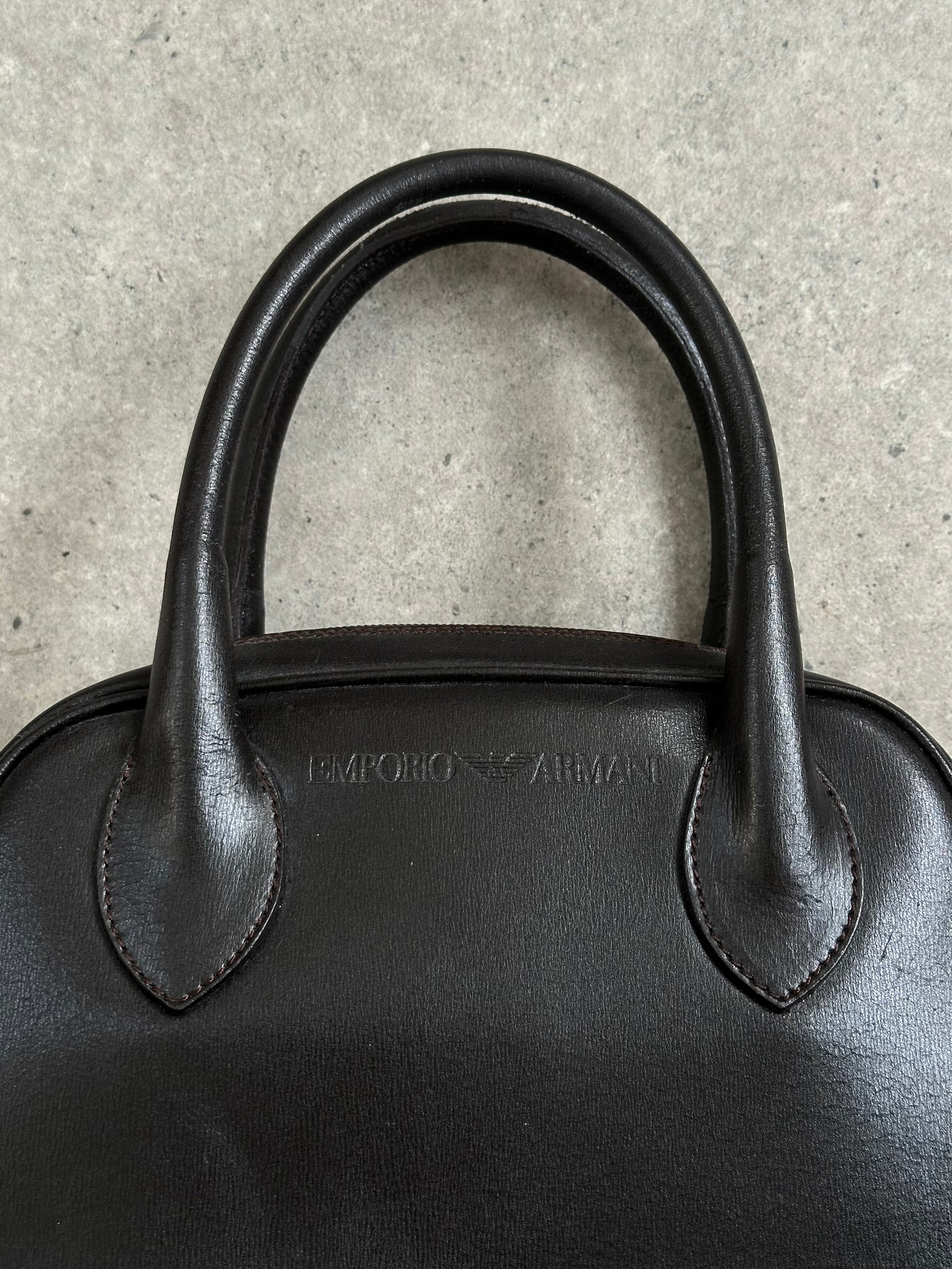 Emporio Armani 2000s leather handbag with sleek design and structured shape, featuring subtle branding and elegant craftsmanship.