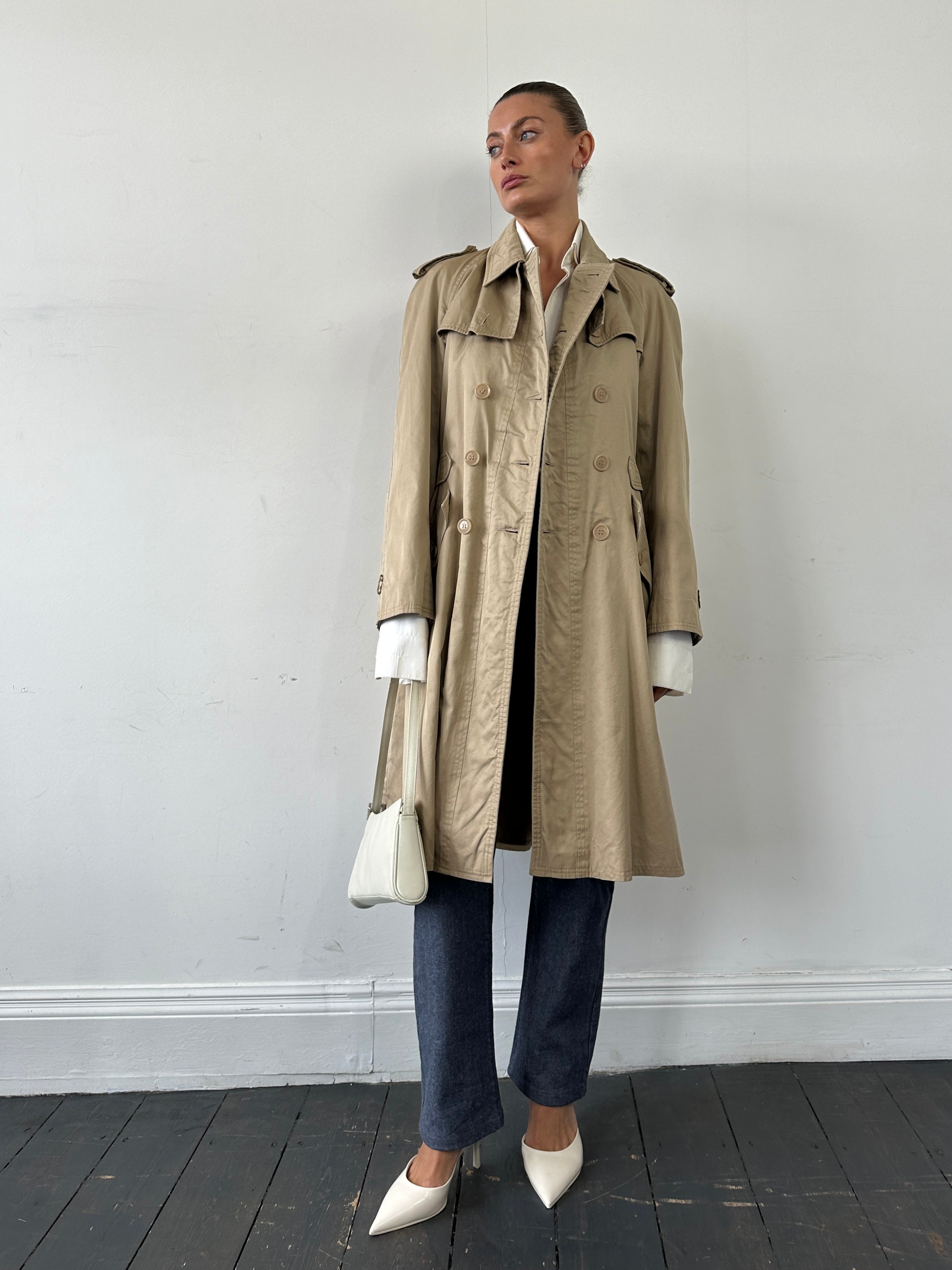 Yves Saint Laurent pure cotton double-breasted trench coat in size M, beige color, with classic collar and button details.
