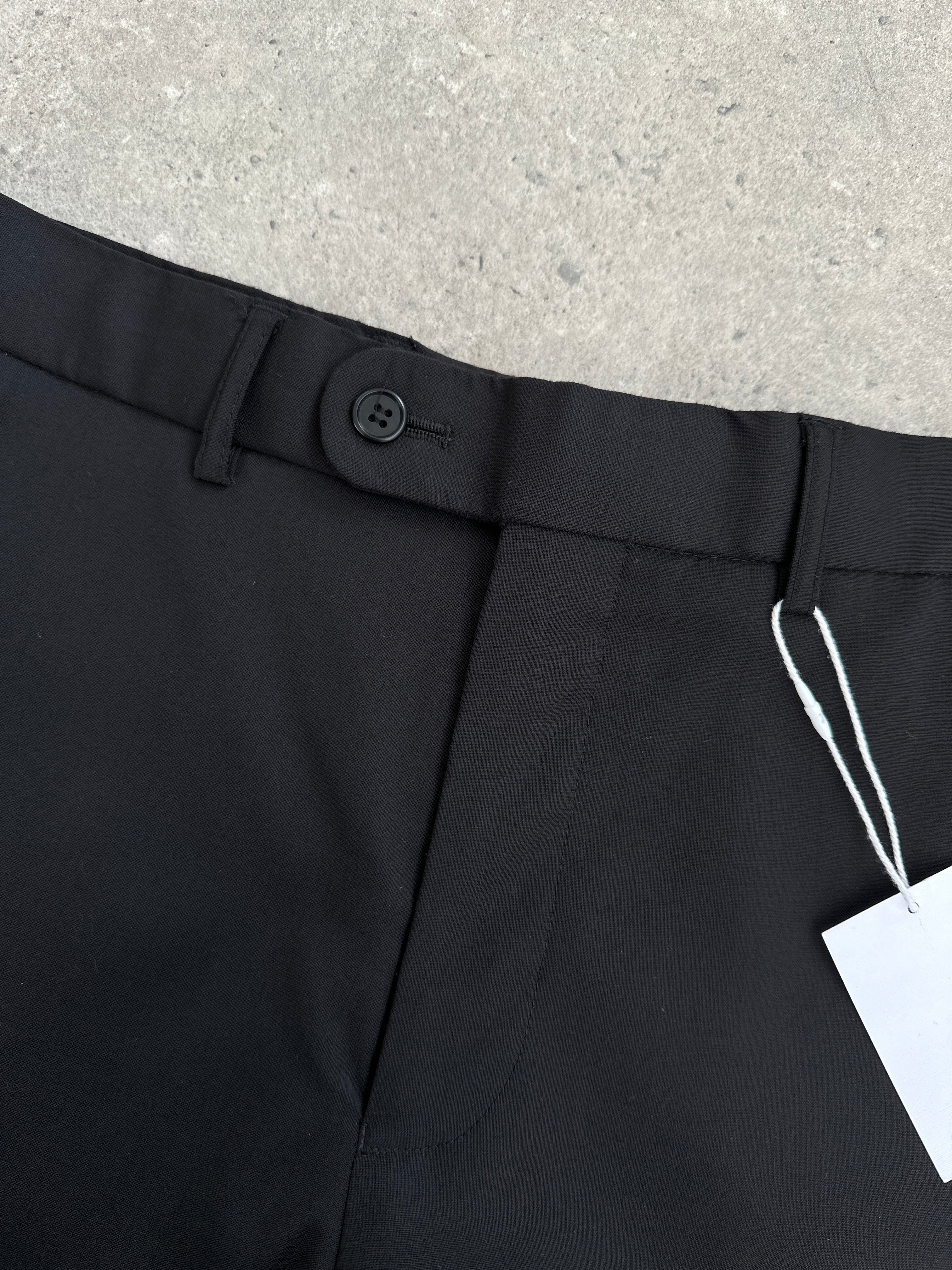 Vintage wool high-waisted straight-leg tailored trousers in W30, showcasing classic fit and textured fabric.