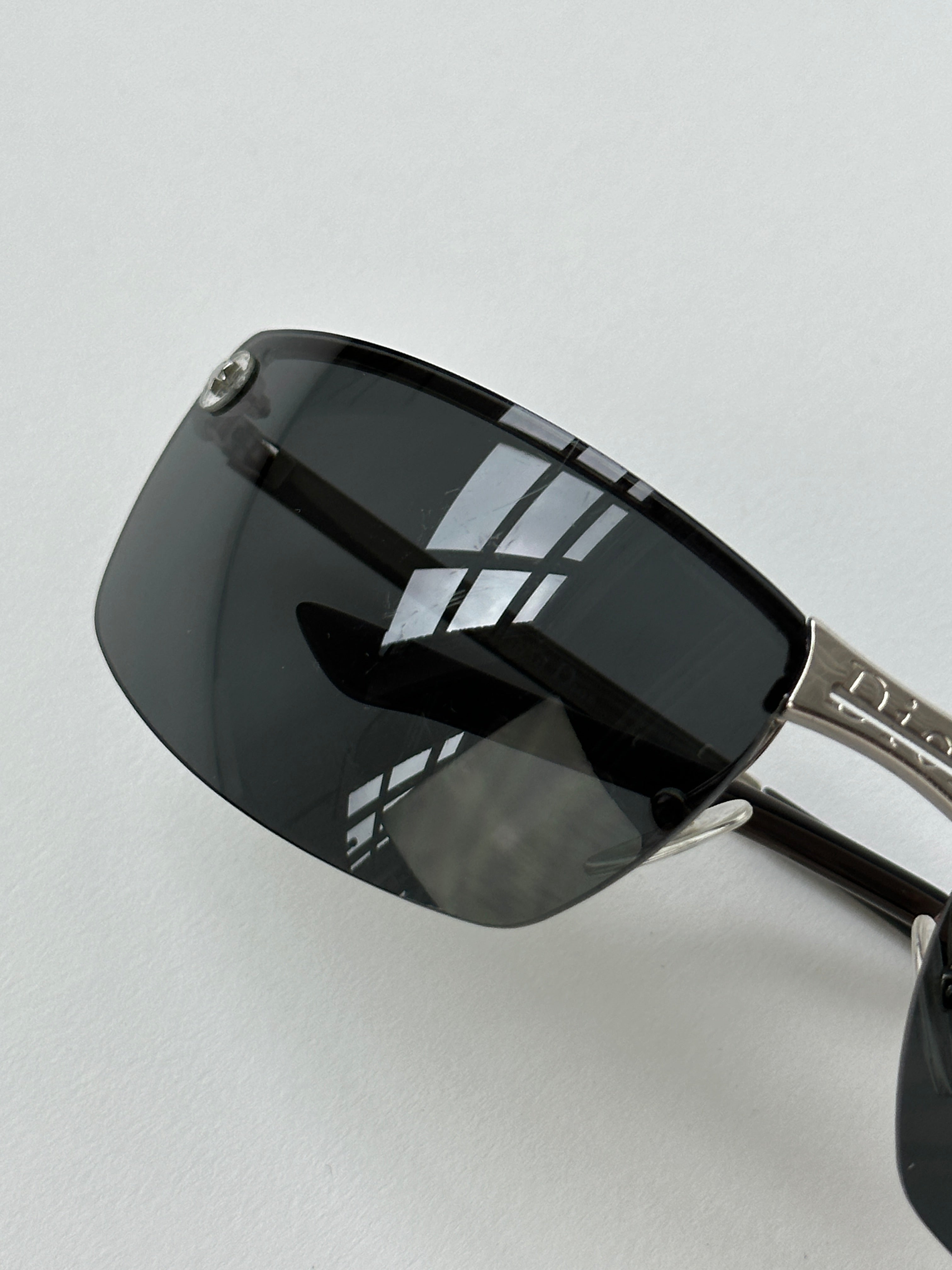 Christian Dior 2000s rimless sunglasses with sleek, modern design and transparent lenses showing on a clean background.