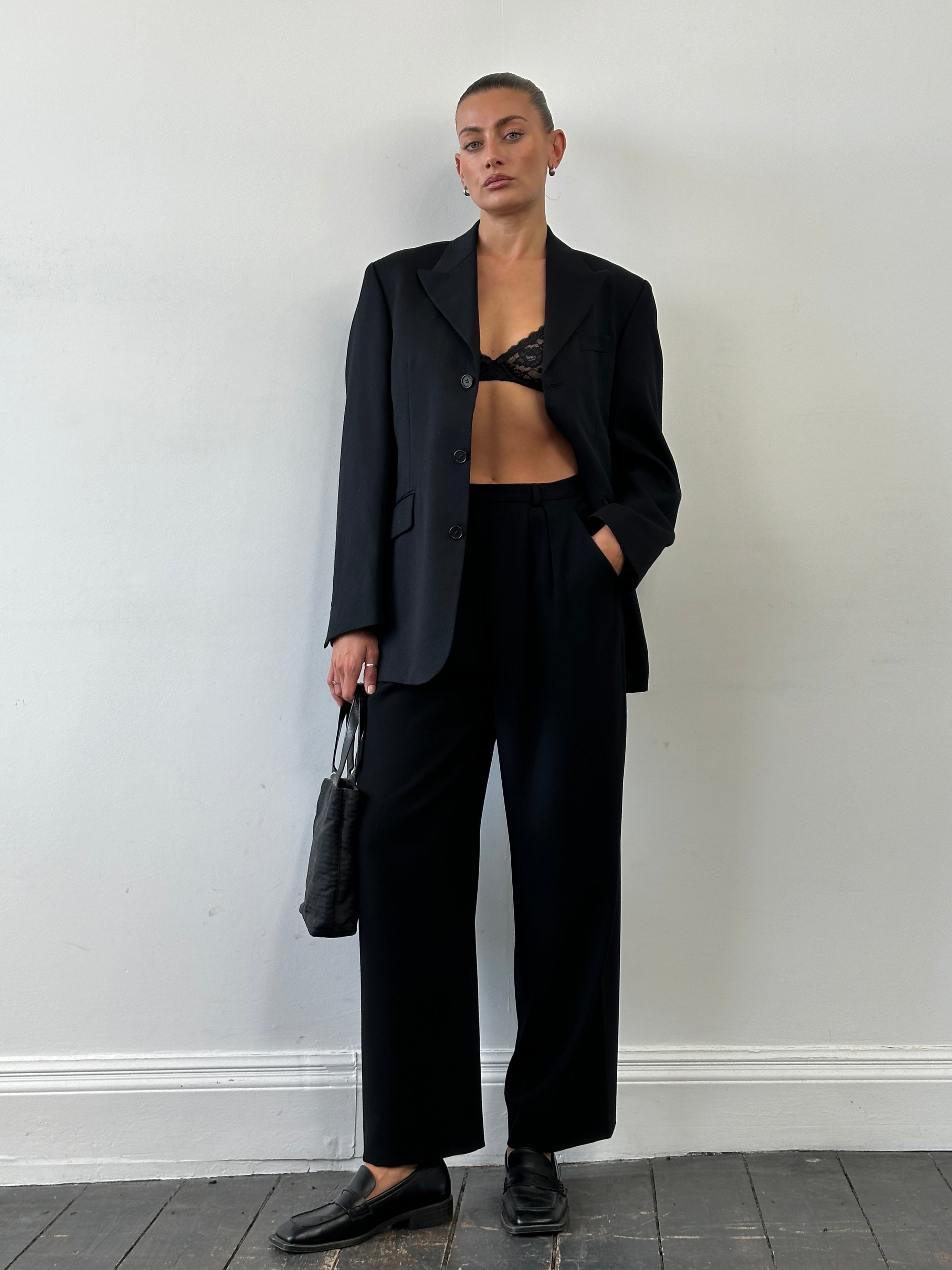 Giorgio Armani 1990s wool wide-leg pleated tailored trousers in W26, showing the classic fit and high-quality fabric.