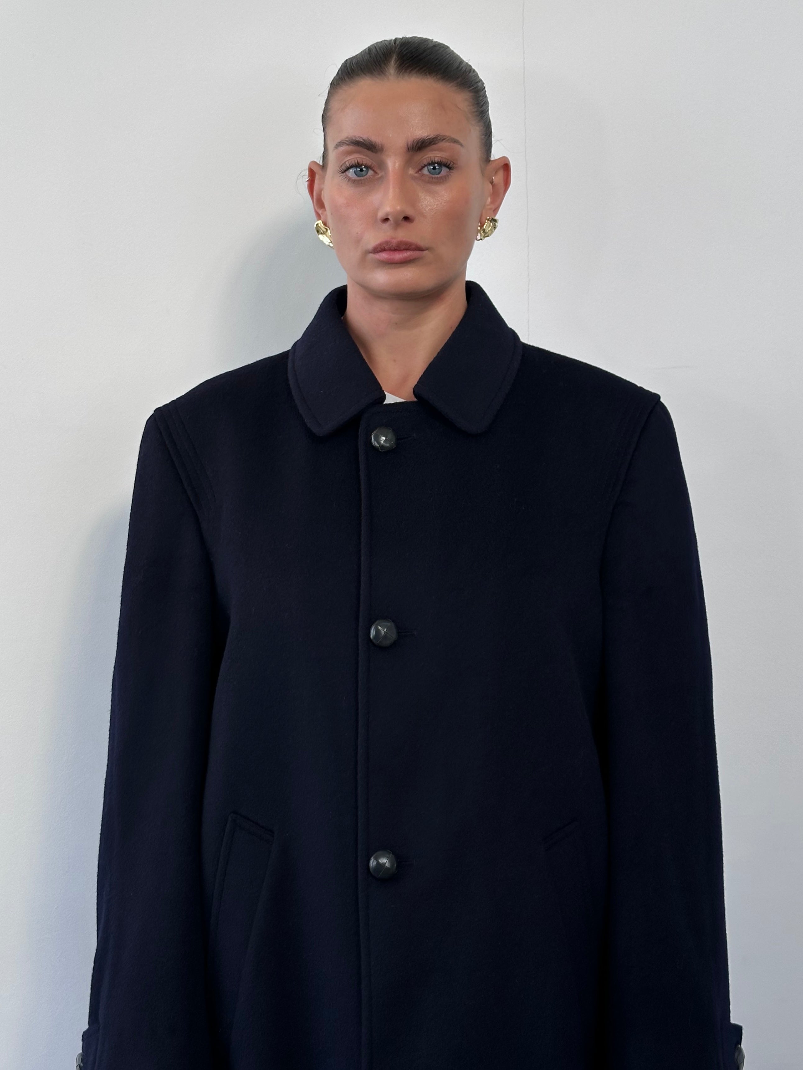 Vintage wool alpaca single-breasted coat in size large, featuring classic tailored design and warm, textured fabric.