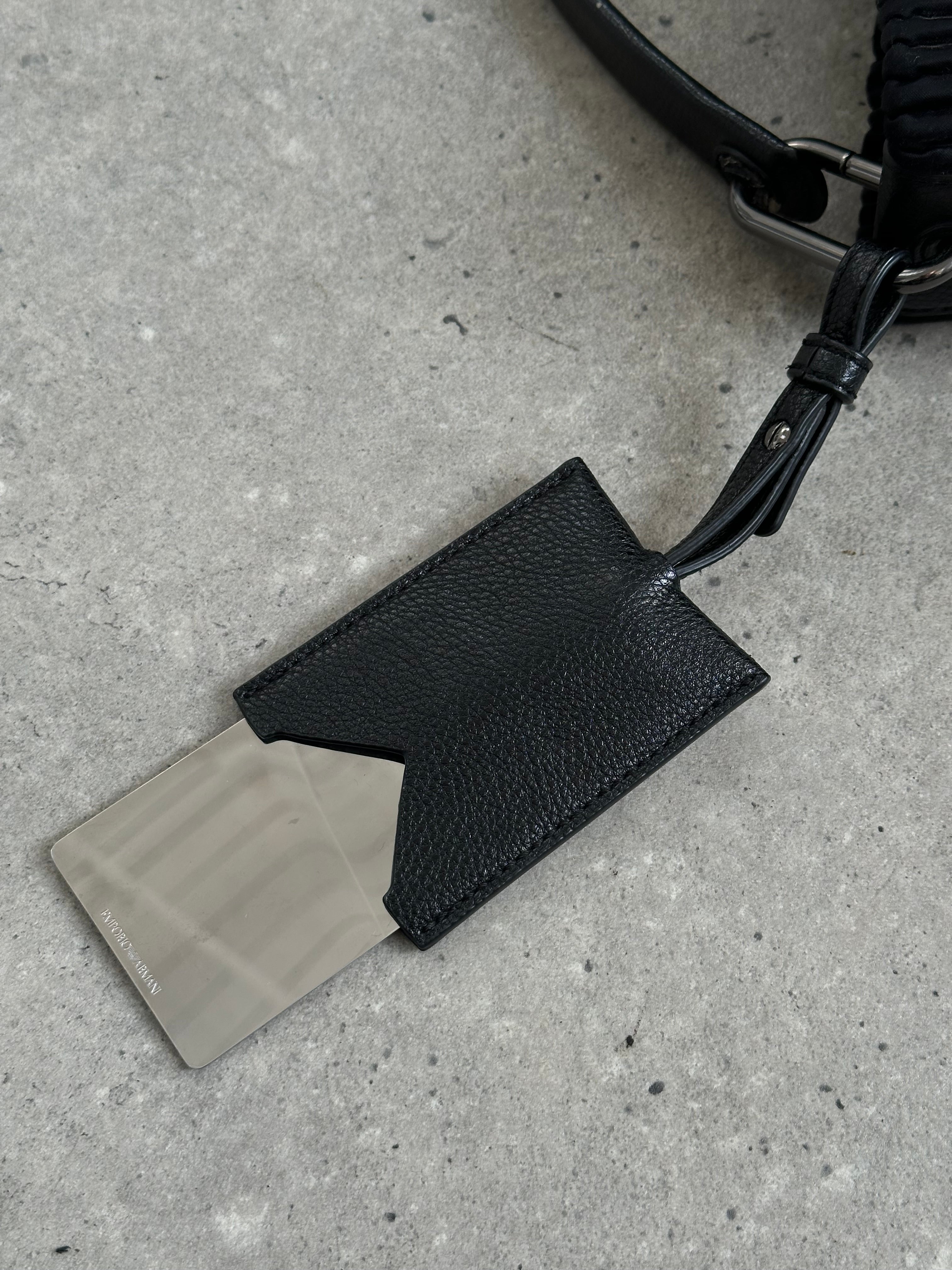 Emporio Armani pleated shoulder bag with structured design, featuring a sleek silhouette and subtle branding details.