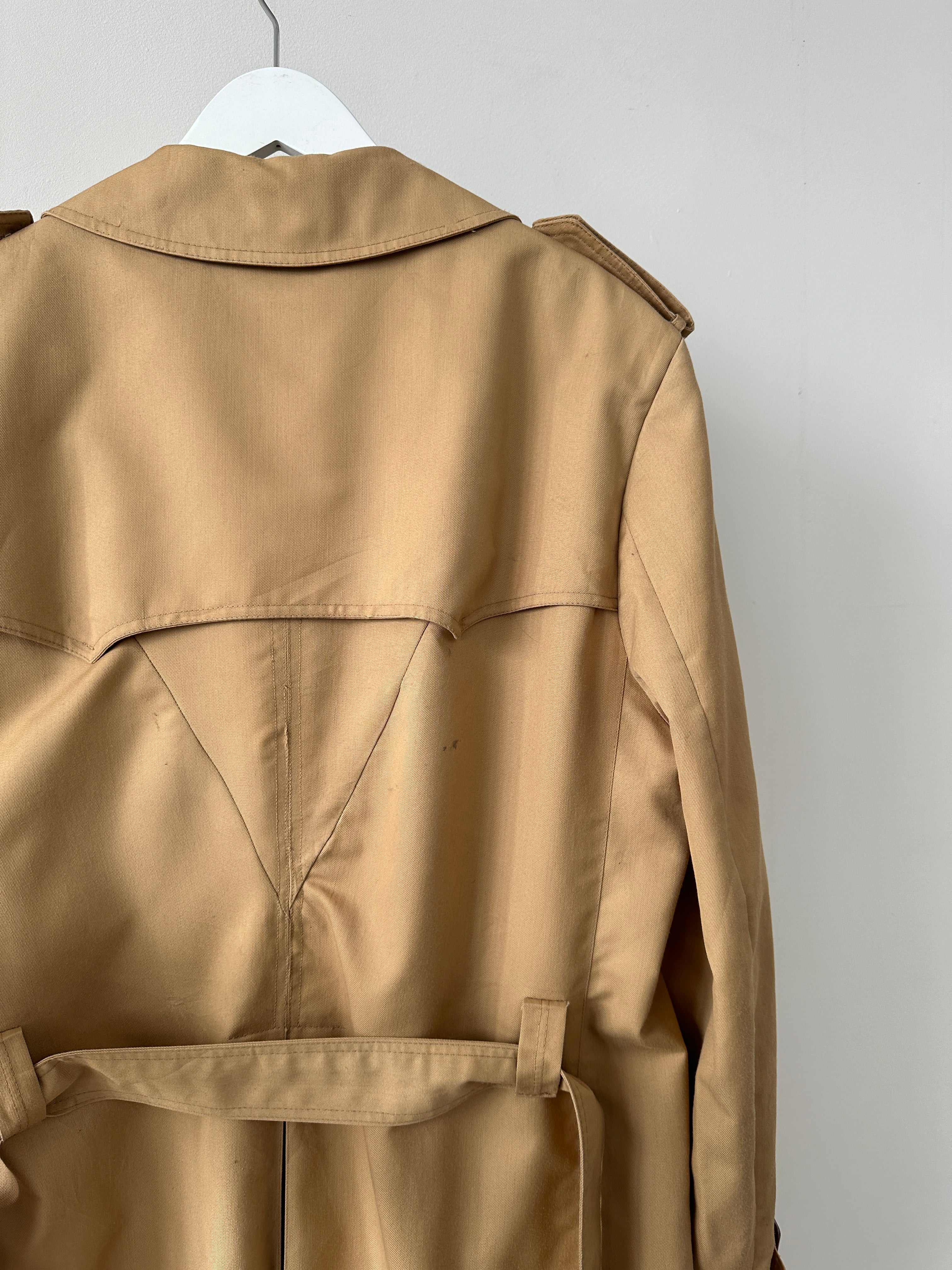 Christian Dior Monsieur double-breasted belted trench coat in XL, beige color, displayed on a hanger with classic design details.