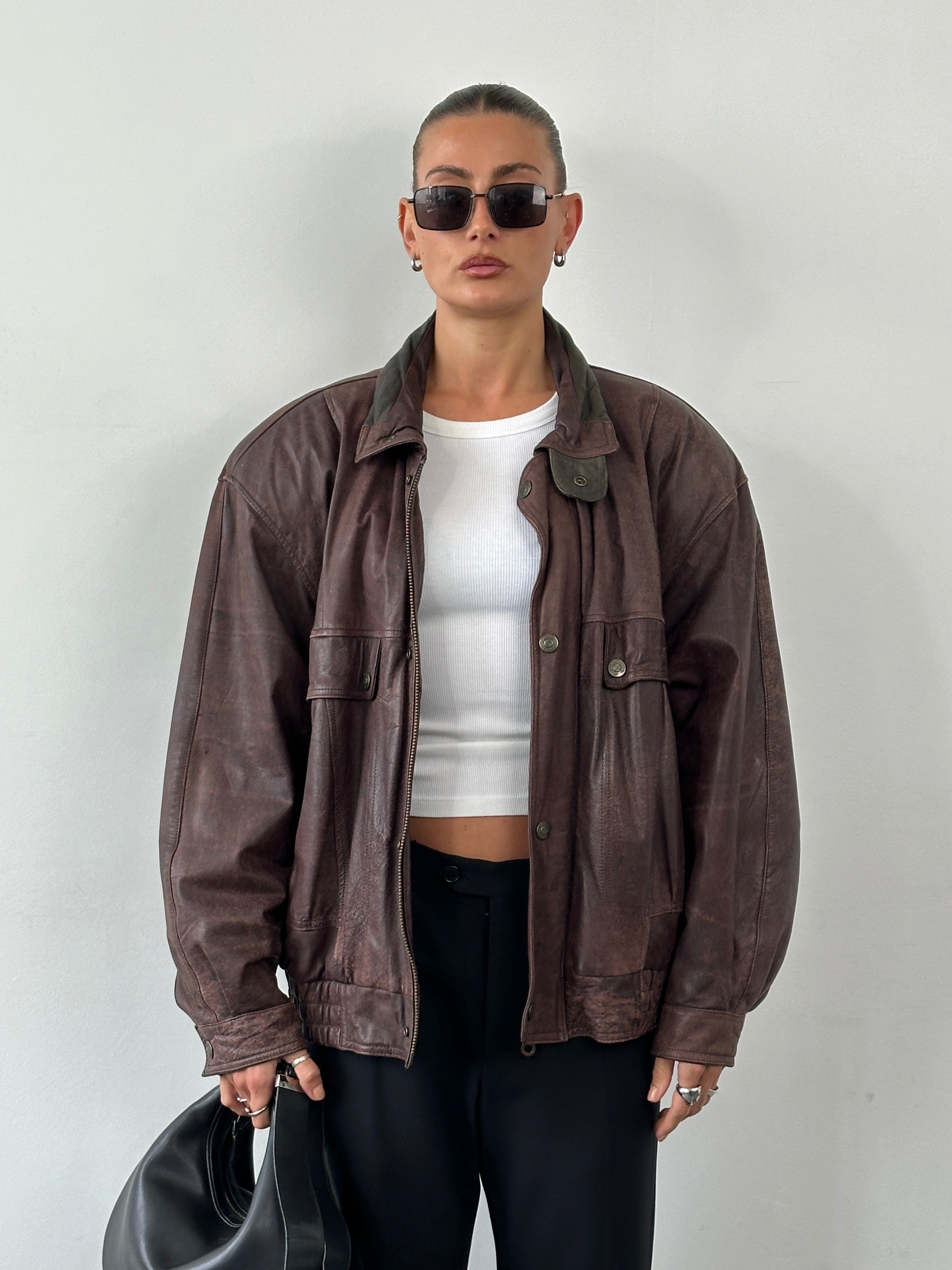 Vintage high neck mottled leather bomber jacket in XL size, featuring a classic design and textured leather finish.
