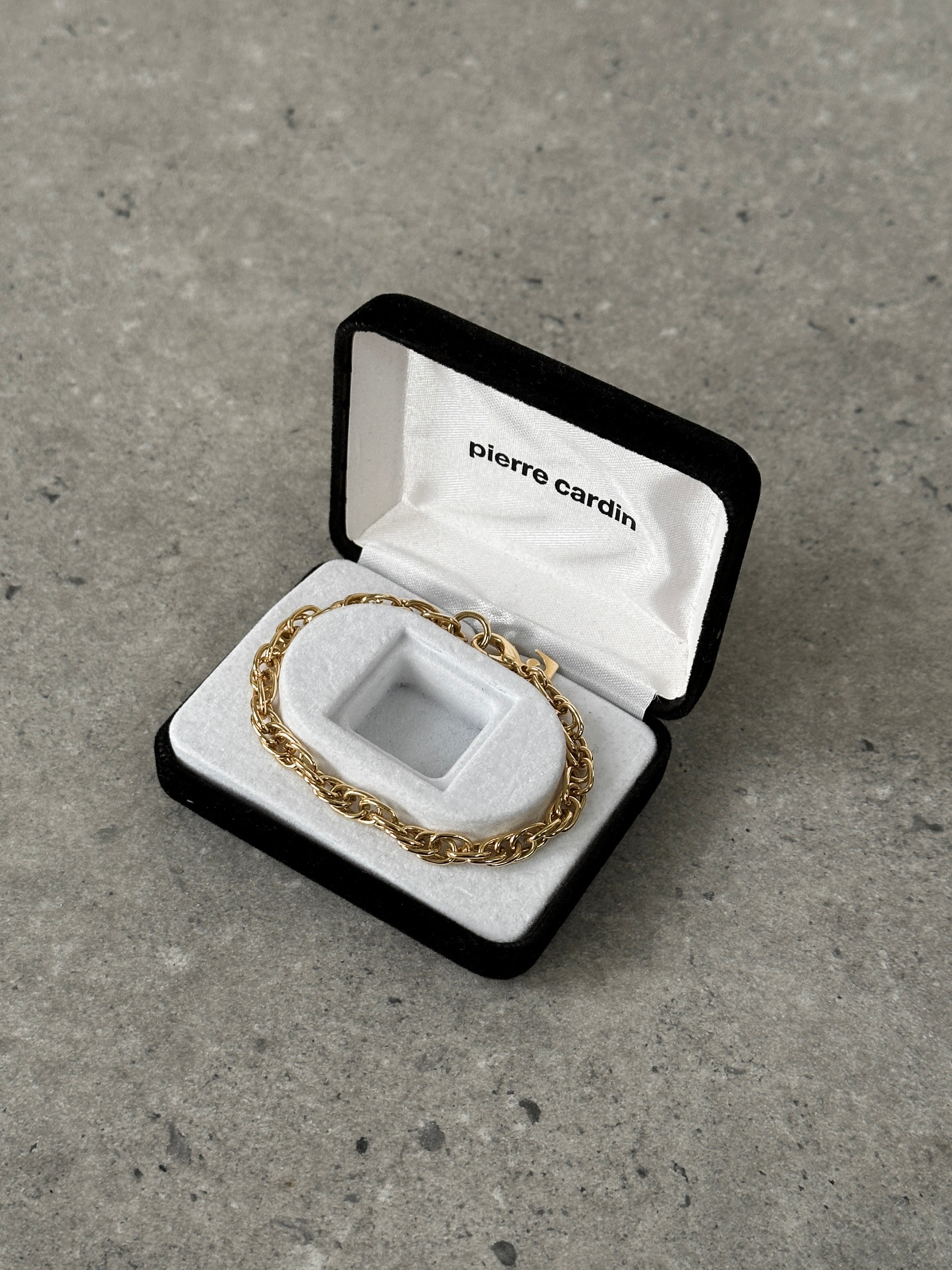 Gold plated Pierre Cardin bracelet with sleek design and clasp, showcasing elegant jewelry craftsmanship.