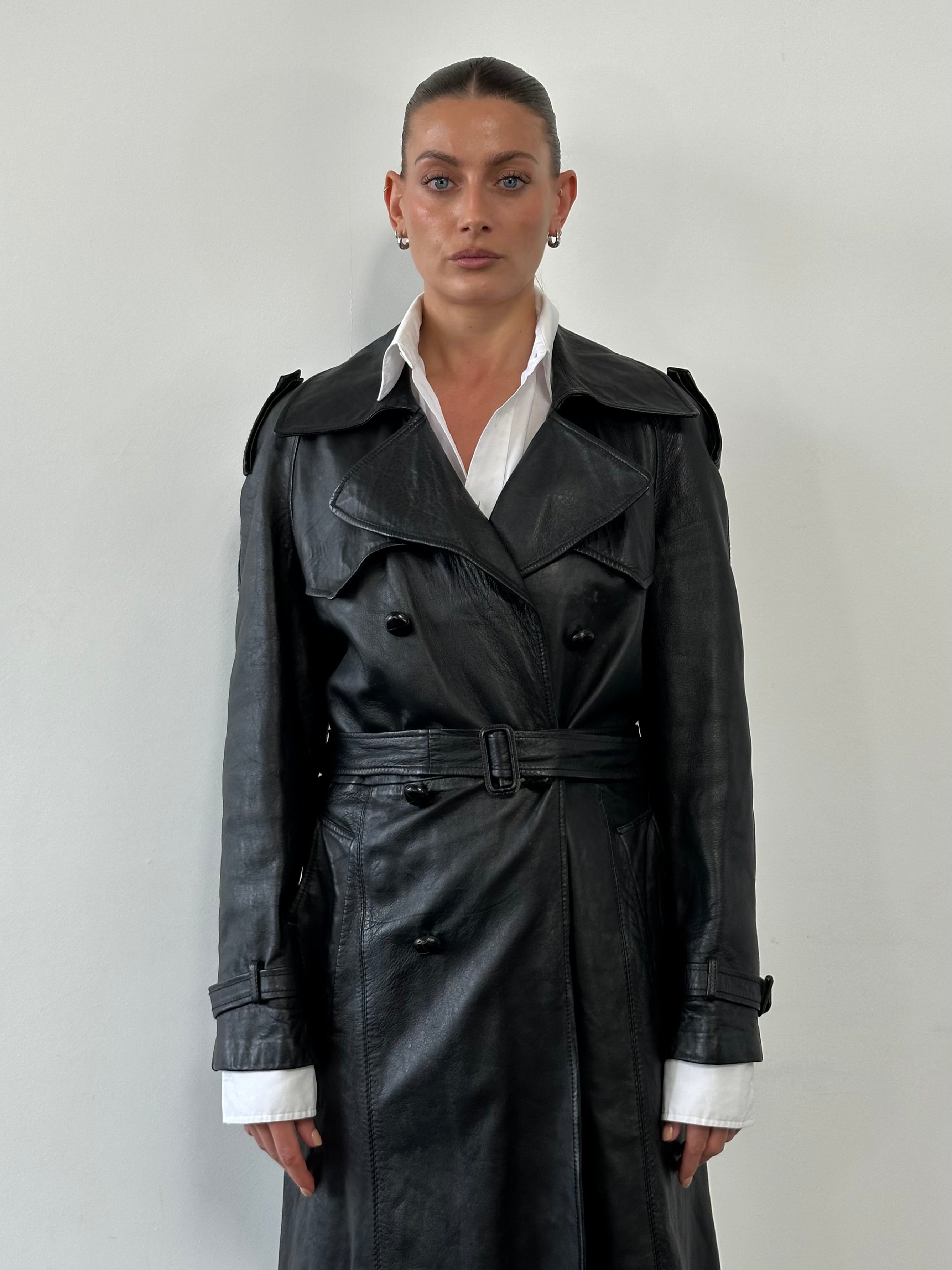 Vintage leather double-breasted belted trench coat in medium size, stylish and classic leather jacket with lapel collar.