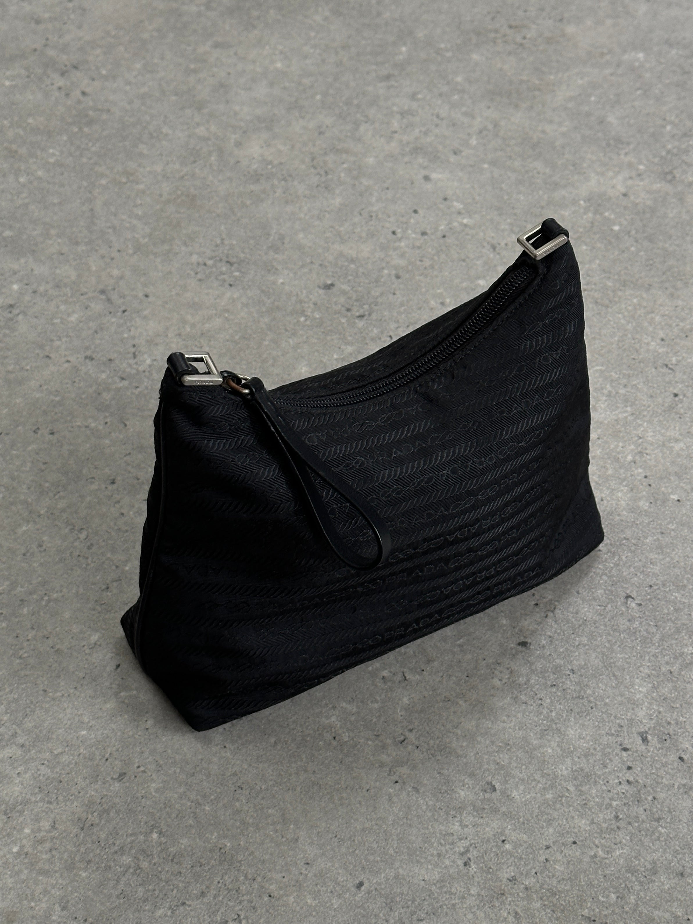 Prada Nylon Tessuto Monogram Crossbody Bag featuring sleek design, adjustable strap, and signature Prada logo on durable nylon fabric.