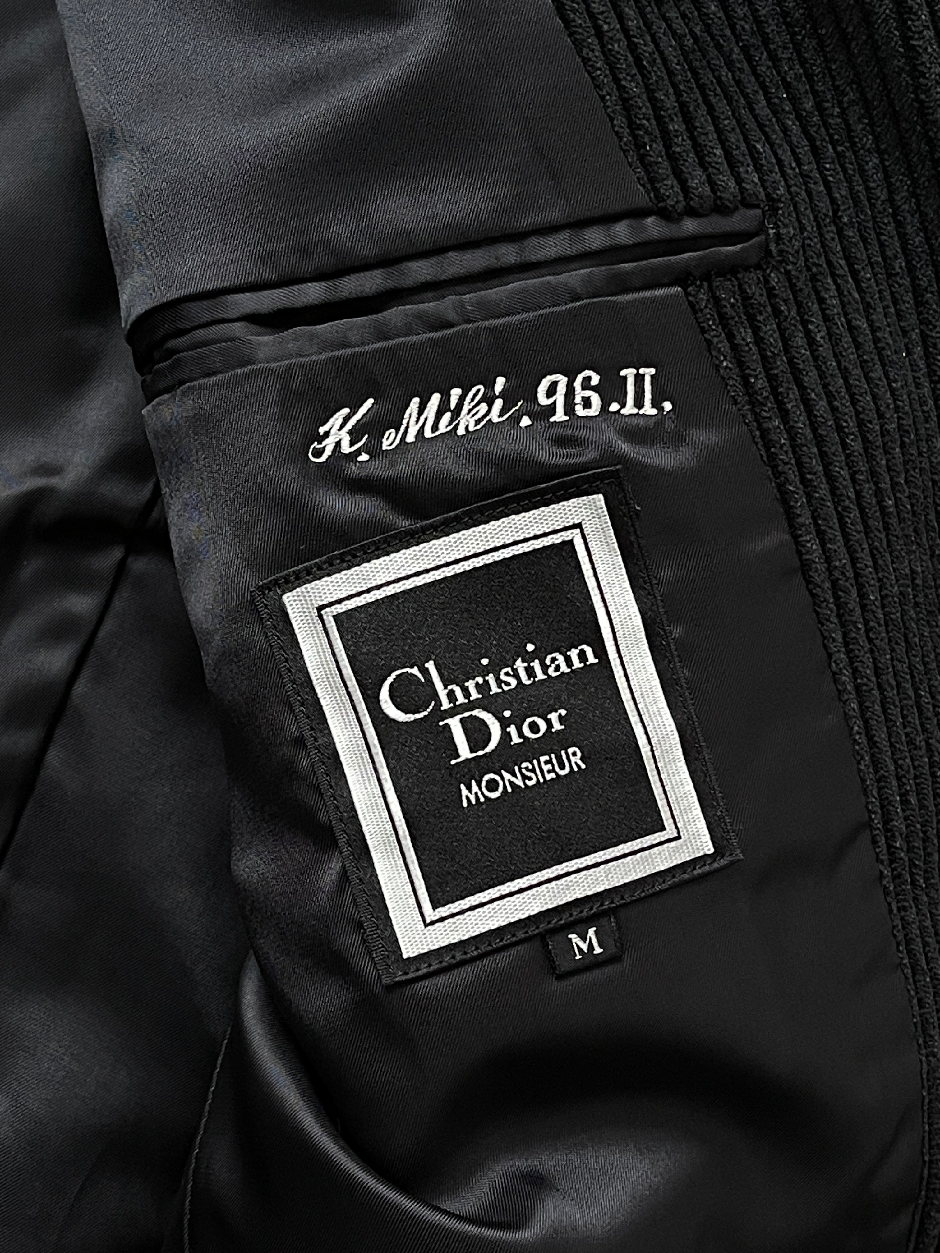 Christian Dior Monsieur 1990s corduroy single-breasted blazer in size 40R/M, shown on a hanger with visible collar and button details.