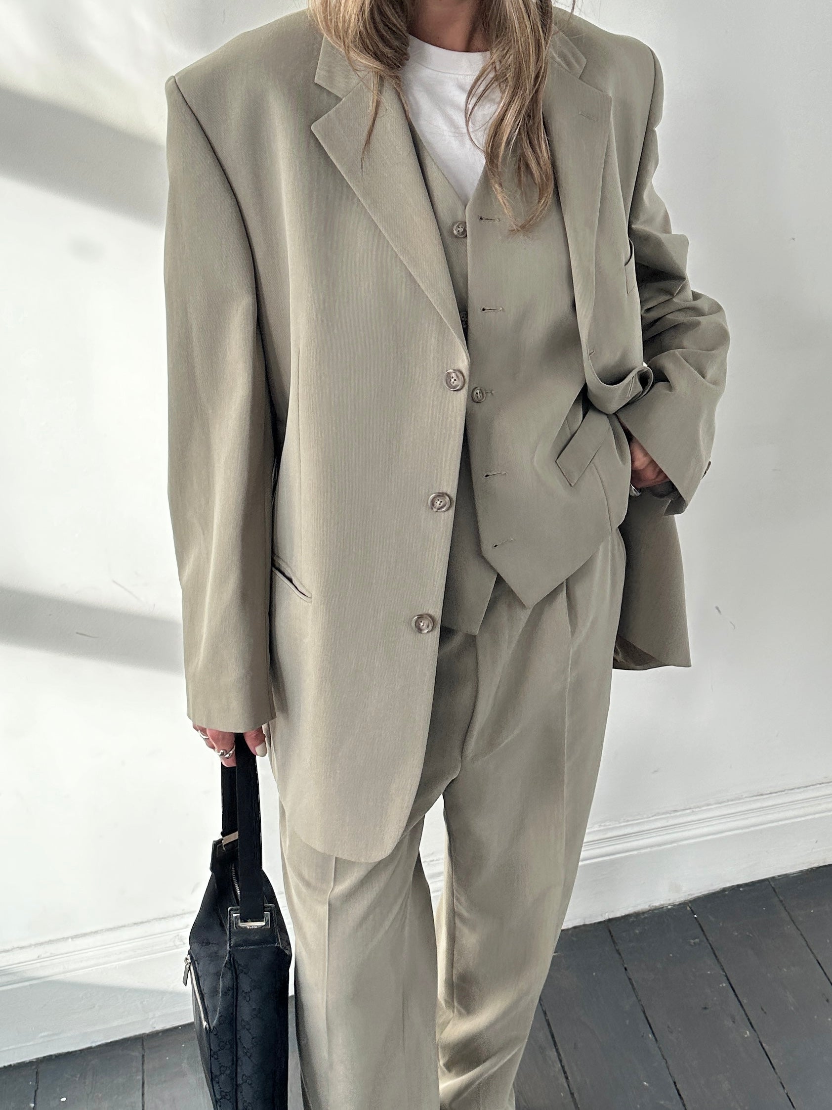 Pierre Cardin three-piece suit, size 44R/W34, tailored formal suit with jacket, vest, and trousers displayed on a hanger.