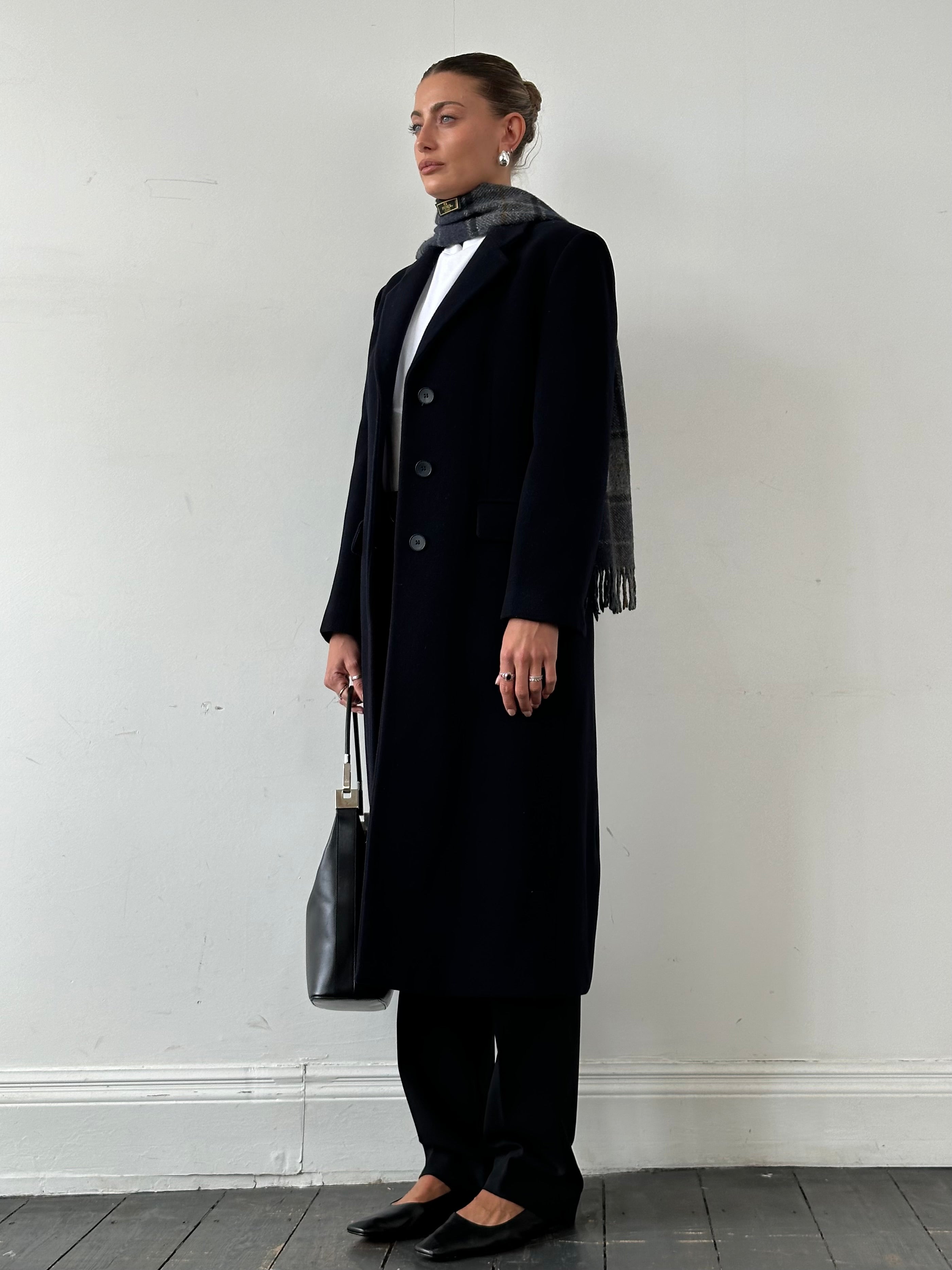 Emporio Armani men's pure wool single-breasted coat in navy, showing the tailored collar and button details.