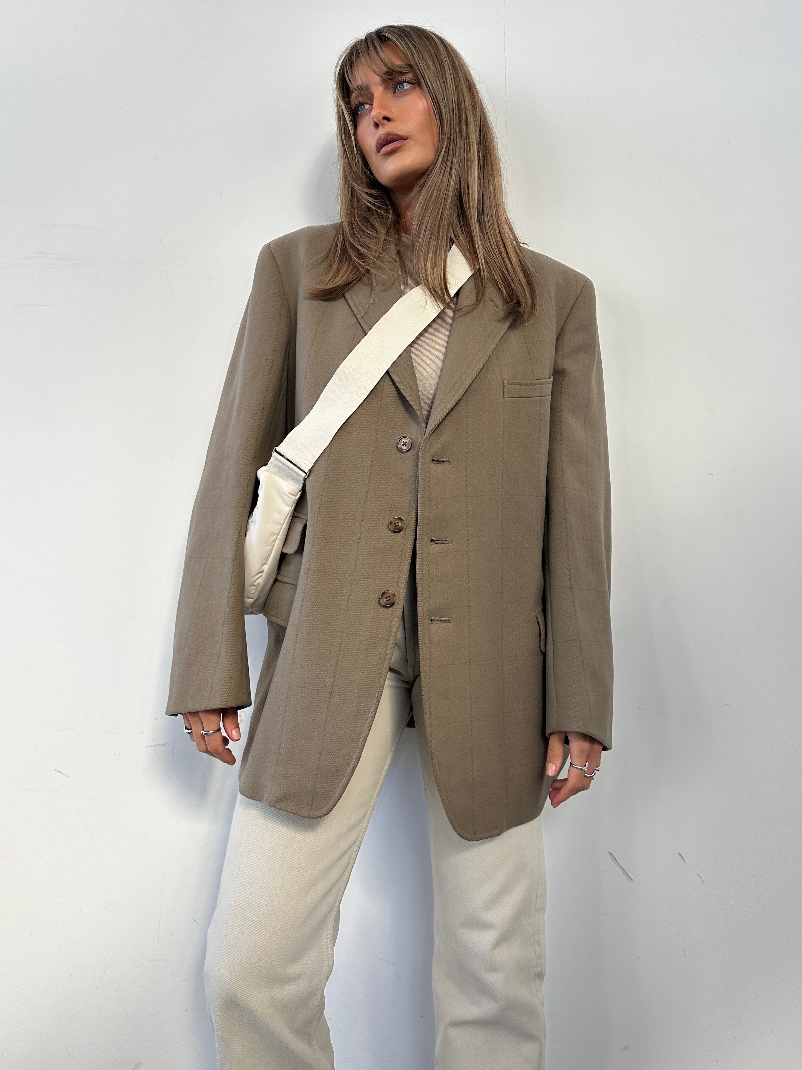 Vintage British thick wool check blazer coat in size L/XL, classic tailored design with a vintage-inspired plaid pattern.