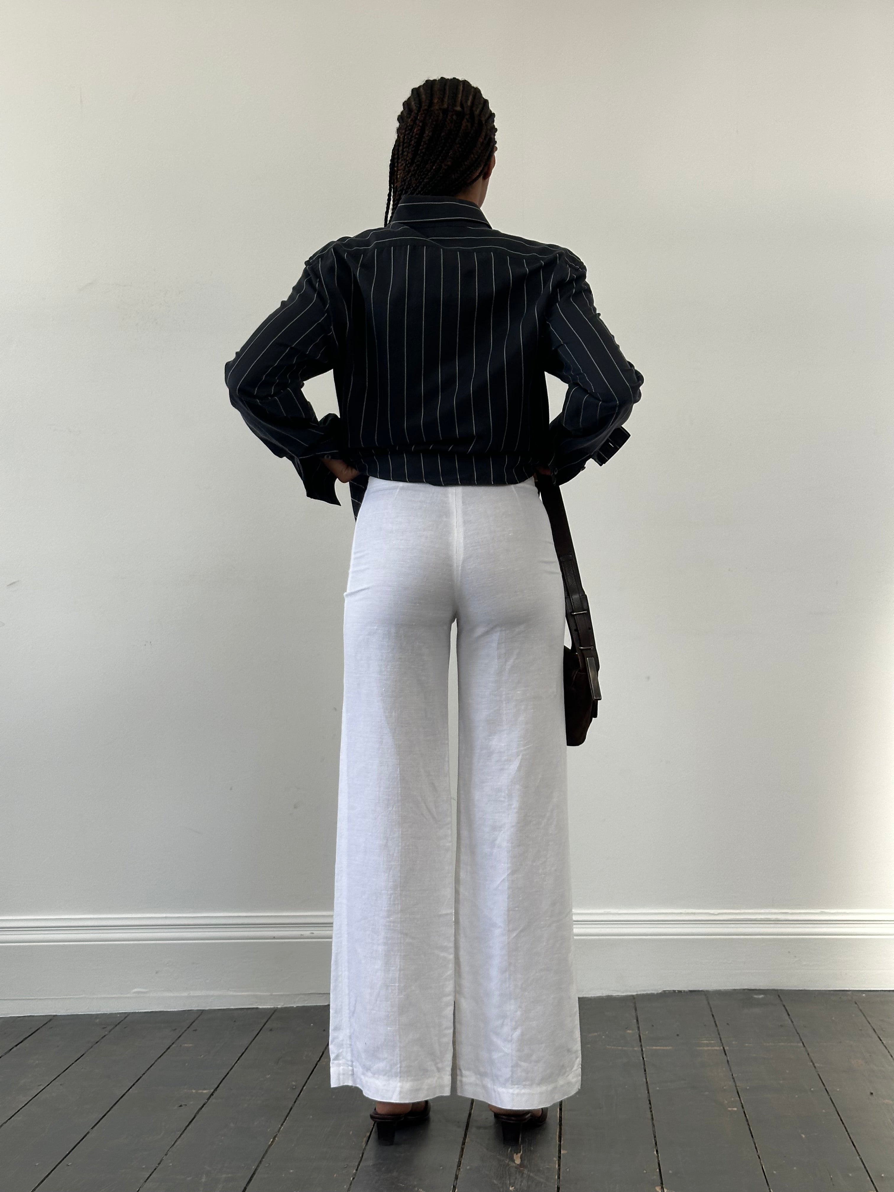 Vintage 1990s pure linen low waist wide leg trousers, size W24, with relaxed fit and classic wide leg style.
