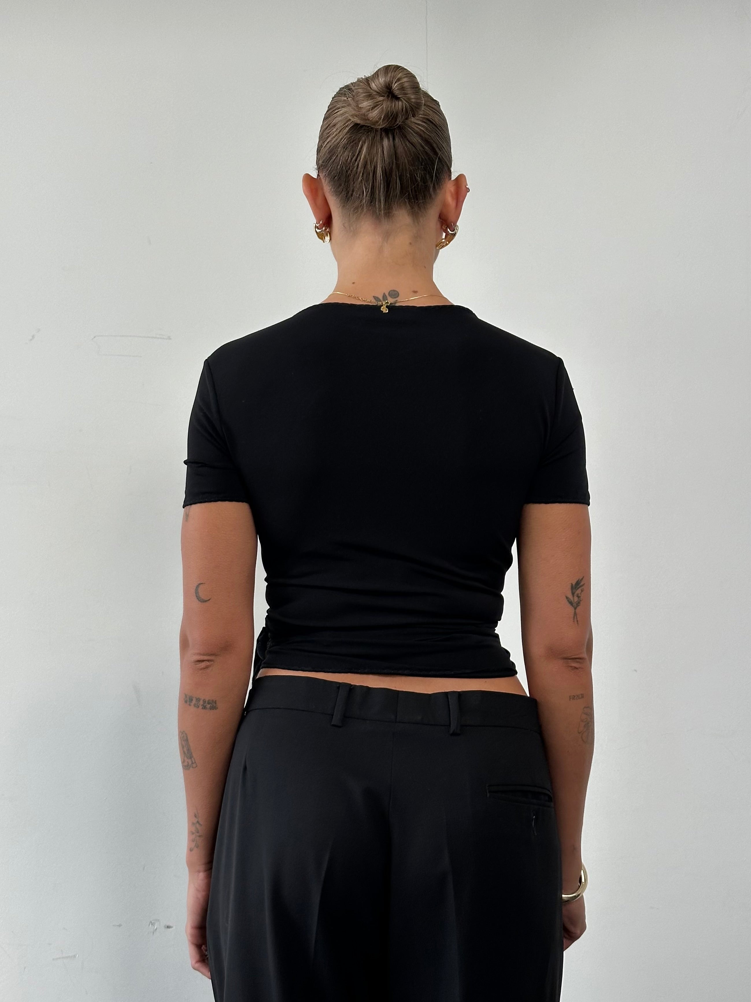 Marella tie wrap top in size M, featuring a stylish V-neck and long sleeves, displayed on a mannequin.