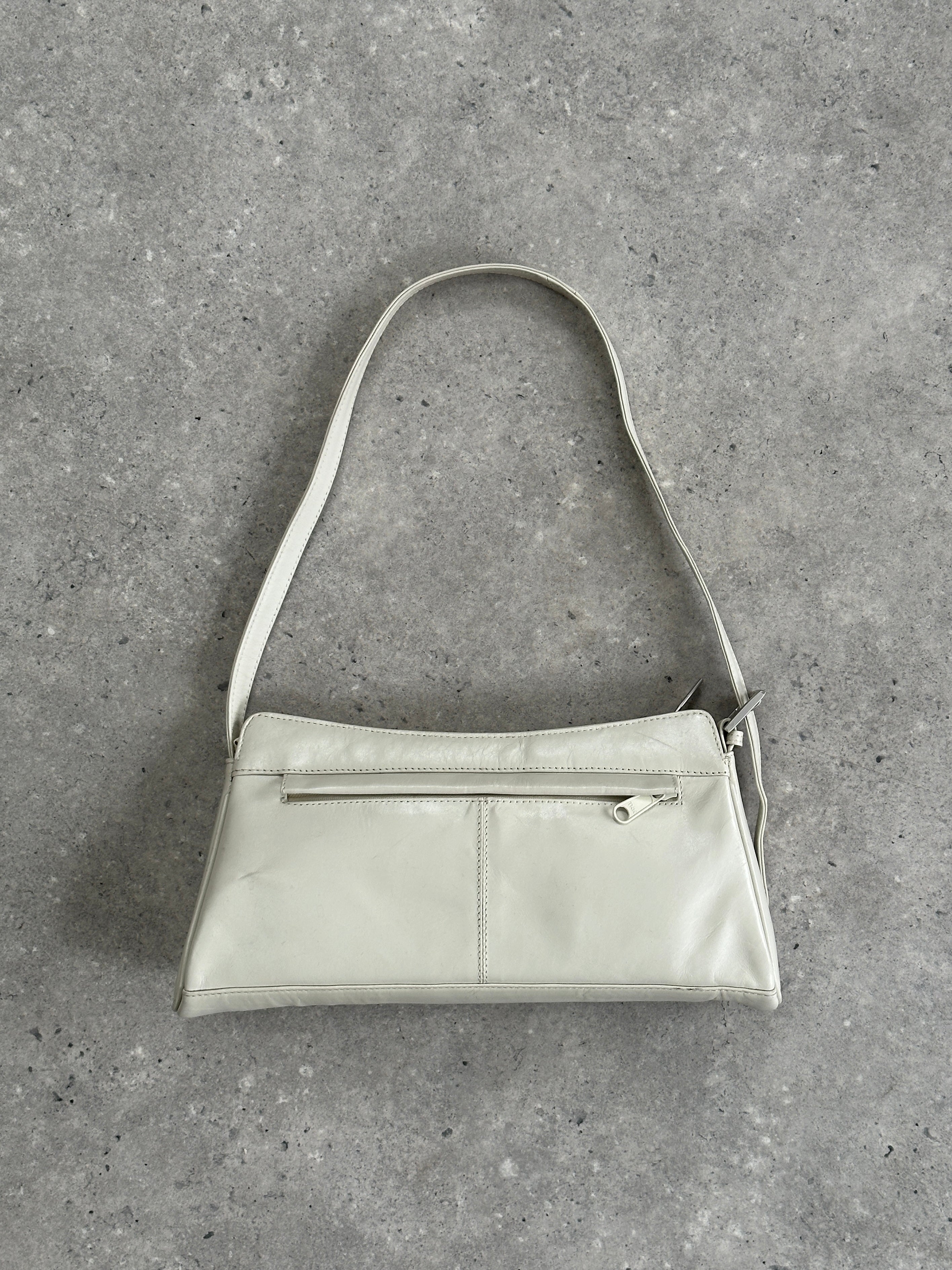 Vintage faux leather A-line shoulder bag with a classic design and adjustable strap, perfect for everyday use.