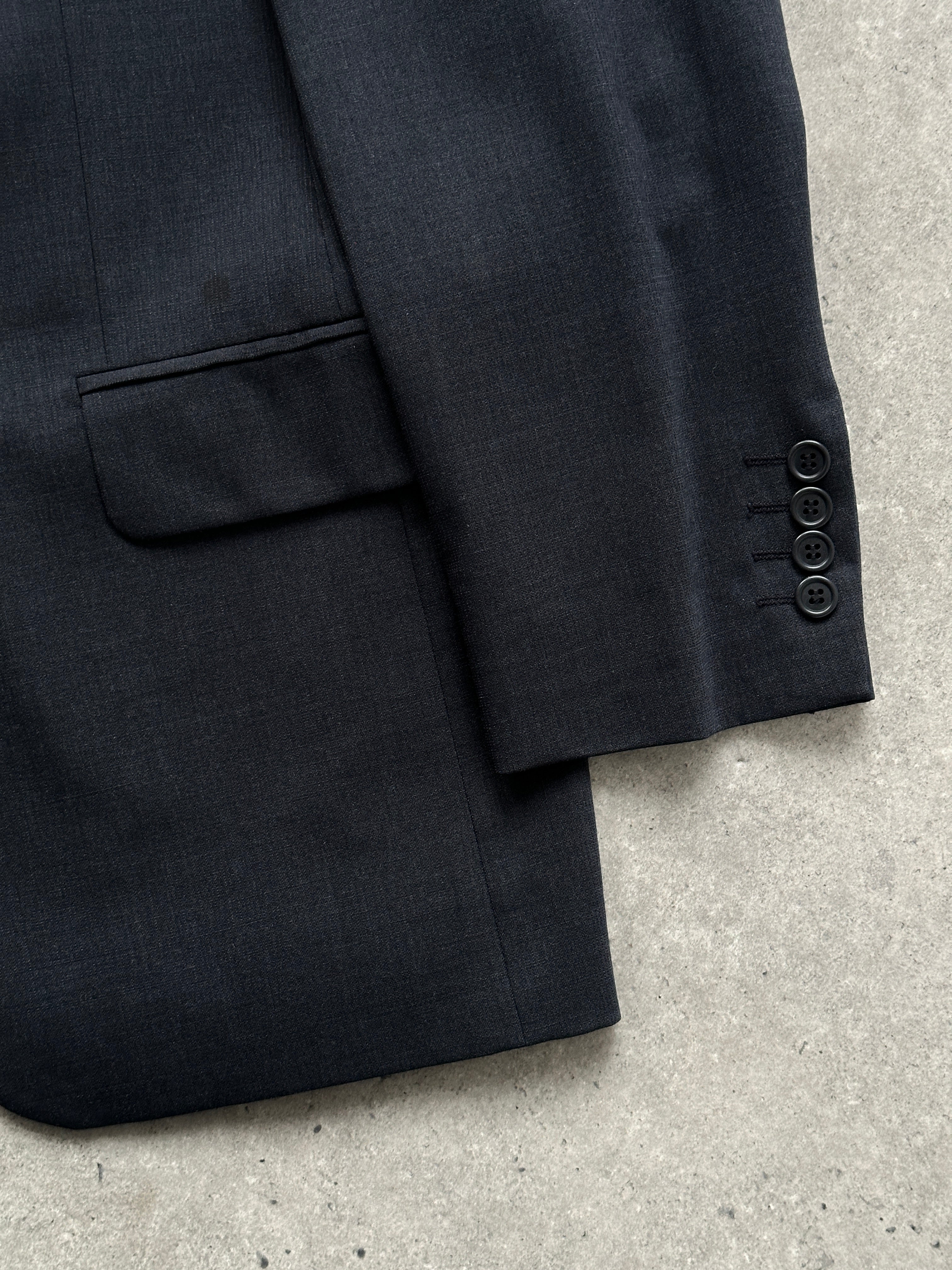 Vintage wool single-breasted jumpsuit in size 38R/W30, featuring tailored fit and classic design, perfect for vintage style.