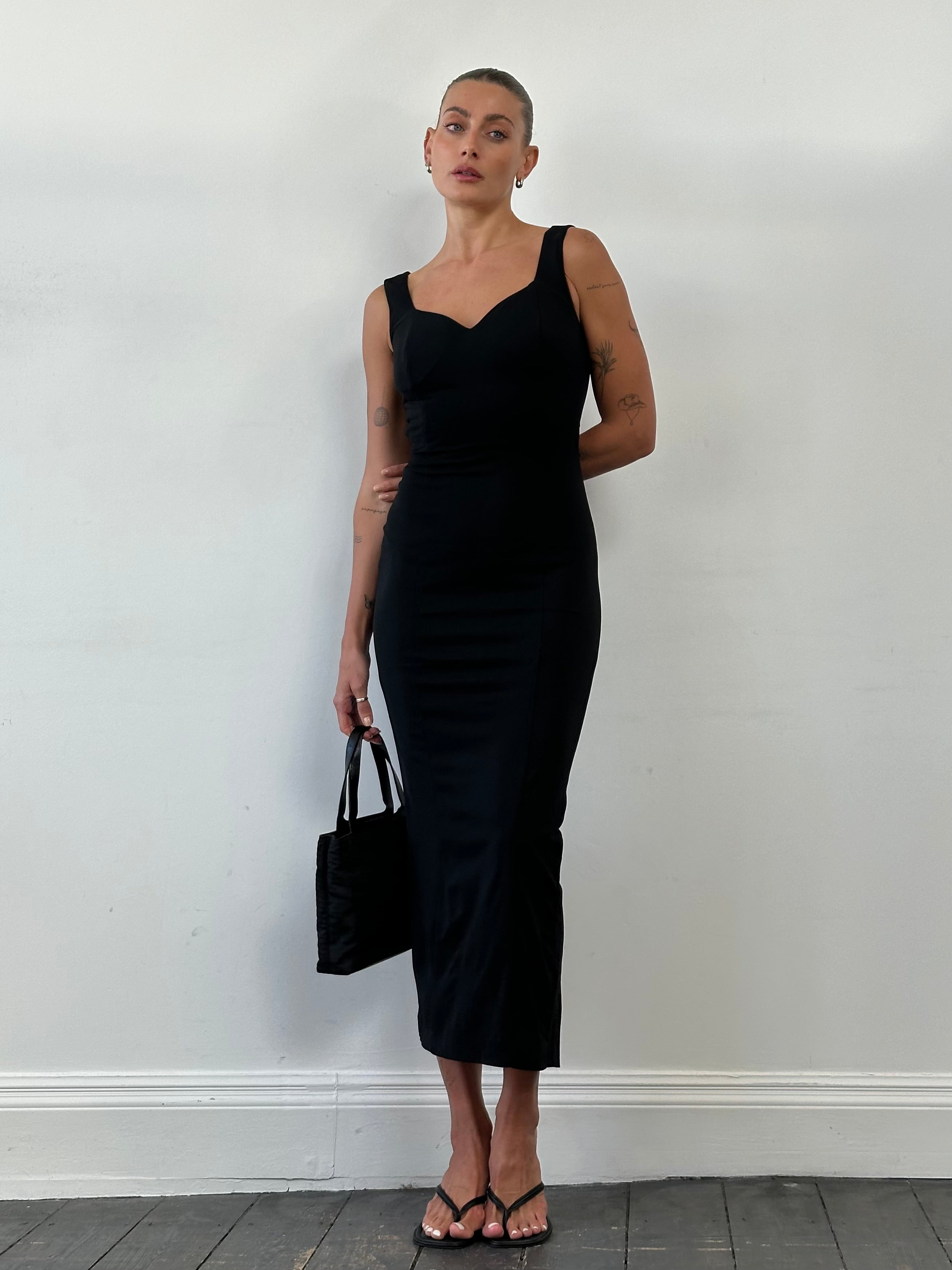 Italian Vintage cut out maxi dress in size small, featuring a flowing silhouette and intricate cut-out details.