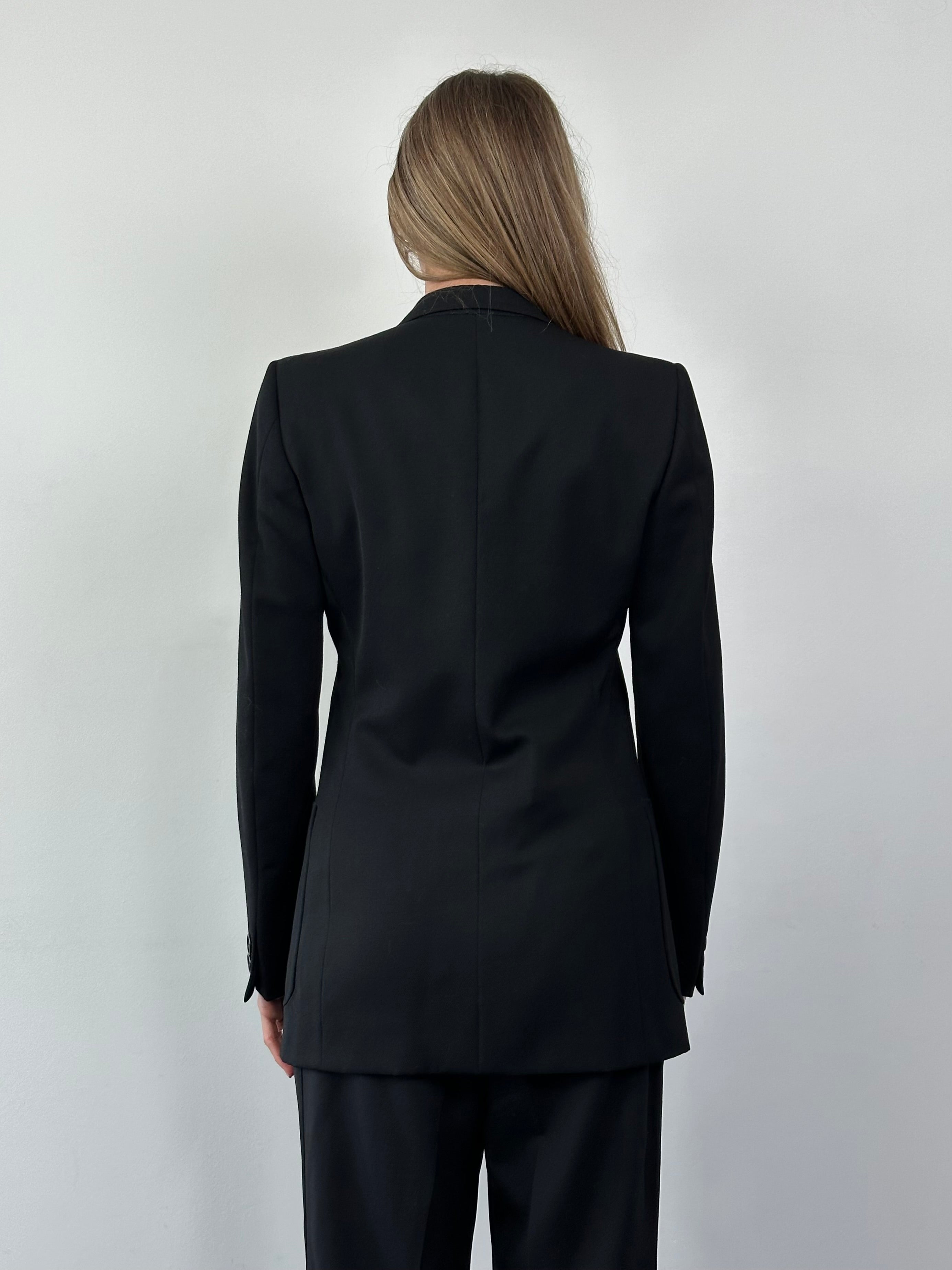Vintage Italian vintage pure wool single-breasted blazer in size small, featuring classic tailored design and natural wool fabric.