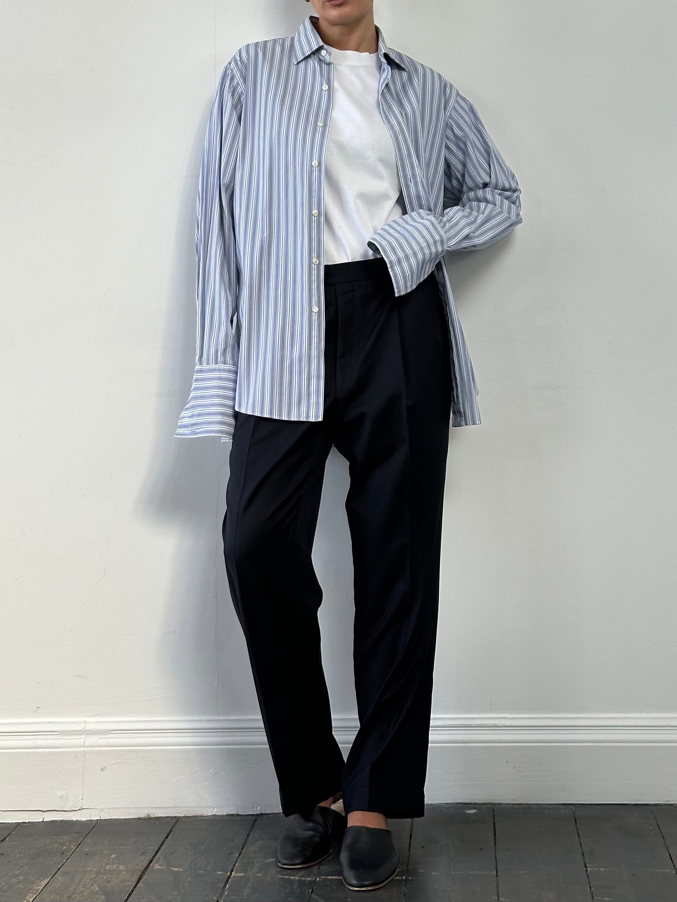Vintage pure wool pleated tailored trousers with straight leg fit, W32, shown hanging flat with front details visible.