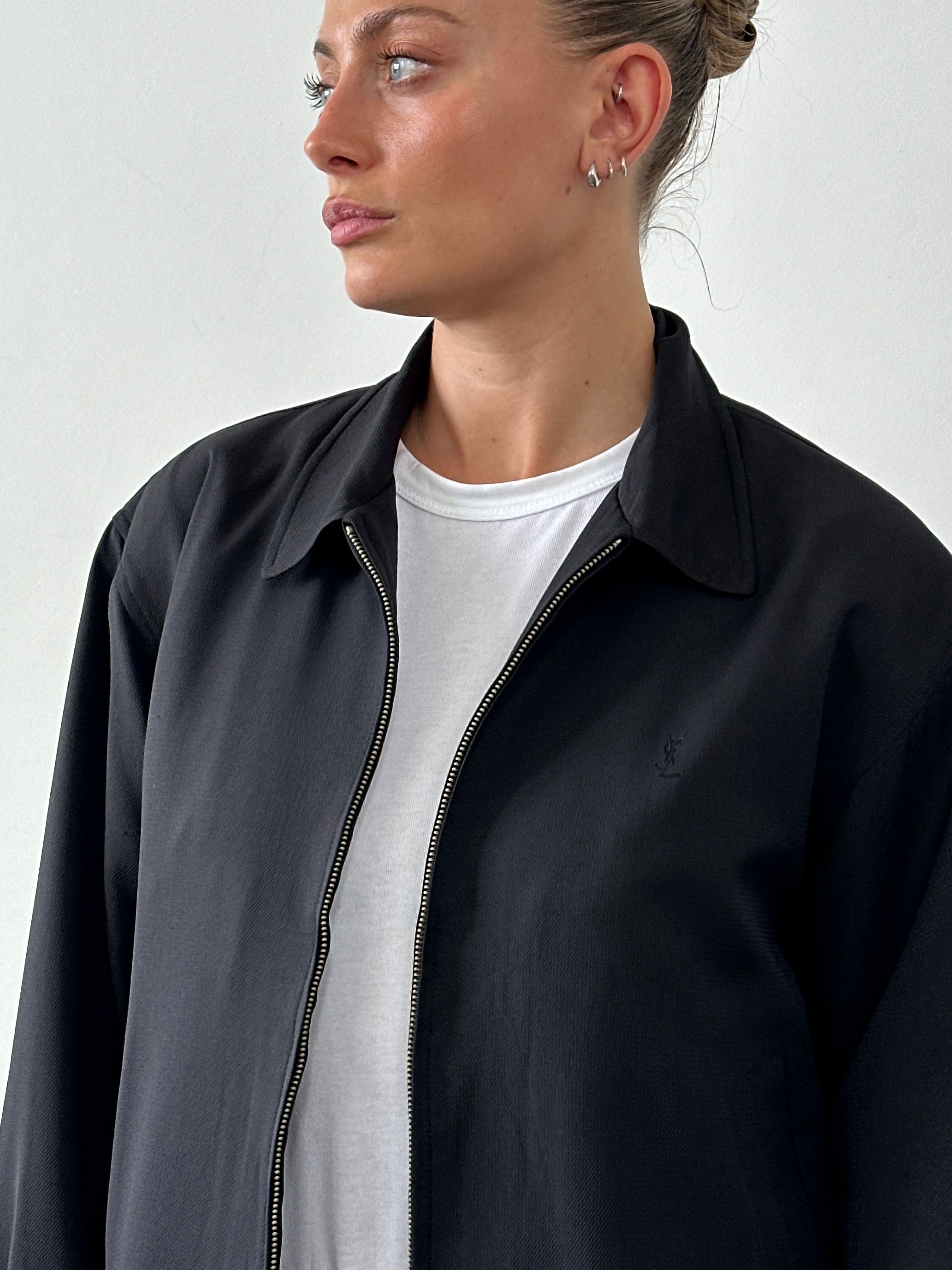 Yves Saint Laurent Pour Homme logo bomber jacket in size M, black with embroidered YSL logo on the front, casual style.