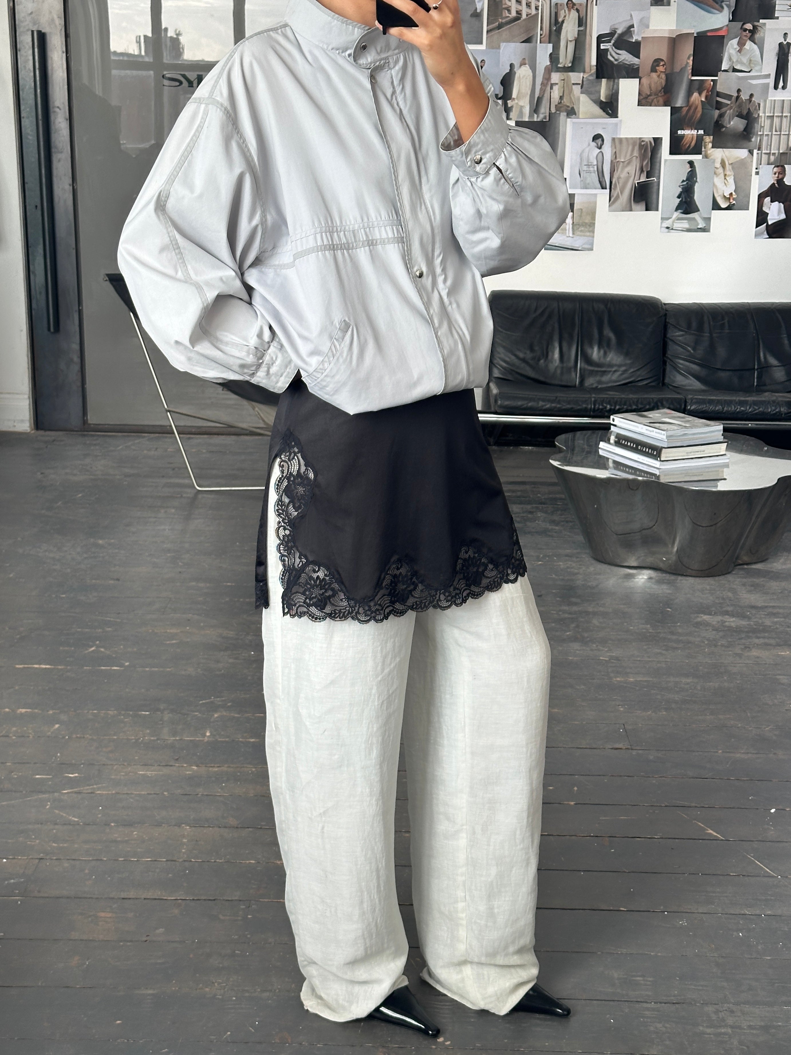 Vintage 2000s high neck bomber jacket in XL size, featuring classic style and retro design, shown on a hanger.