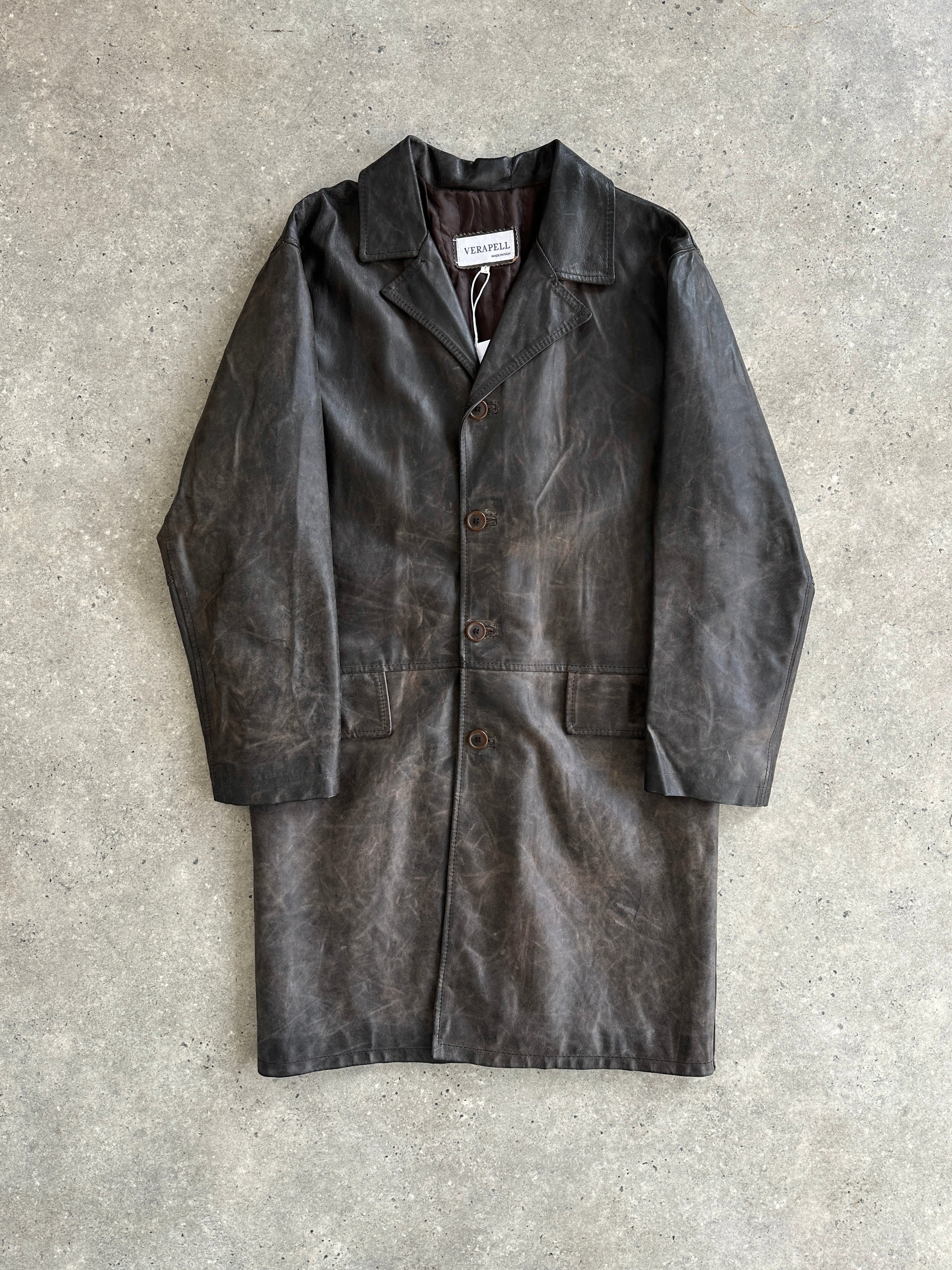 Vintage Italian distressed leather jacket, size large, featuring rugged texture and classic style, displayed on a hanger.