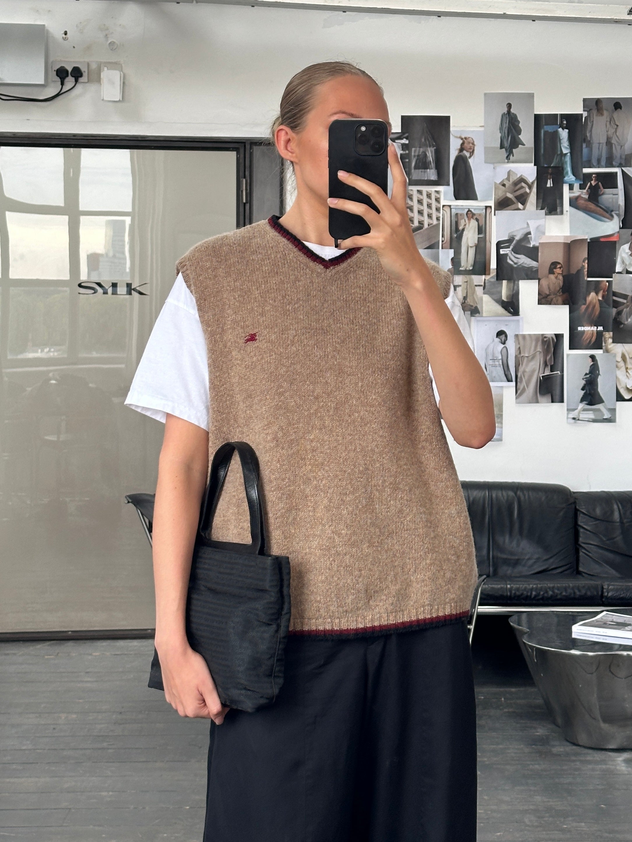 Burberry London 2000s pure wool sleeveless logo knitted jumper in size M/L, featuring classic Burberry design and knit pattern.