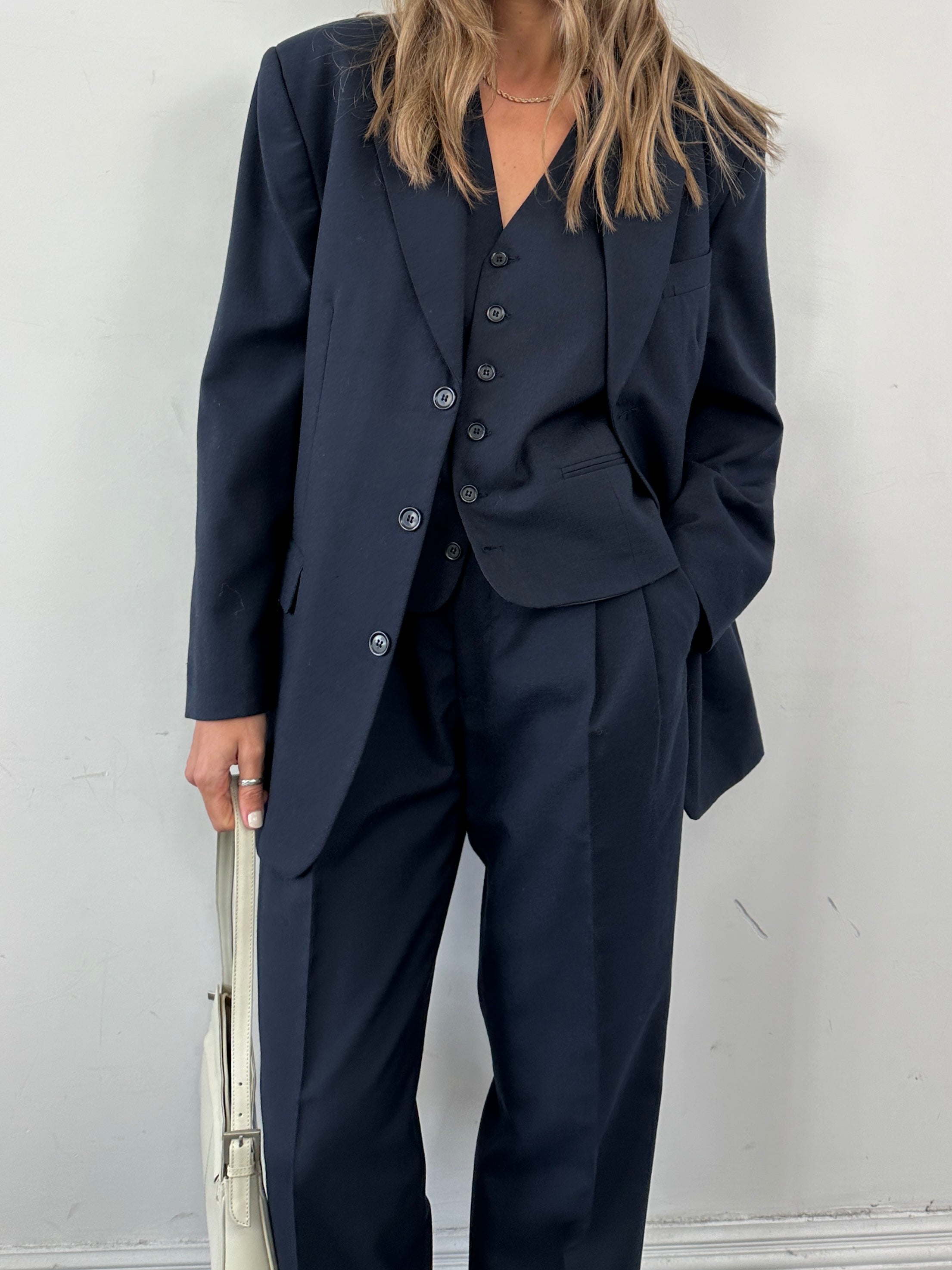 Vintage wool blend single-breasted three-piece suit in size 38R, featuring a jacket, vest, and trousers, on a hanger.