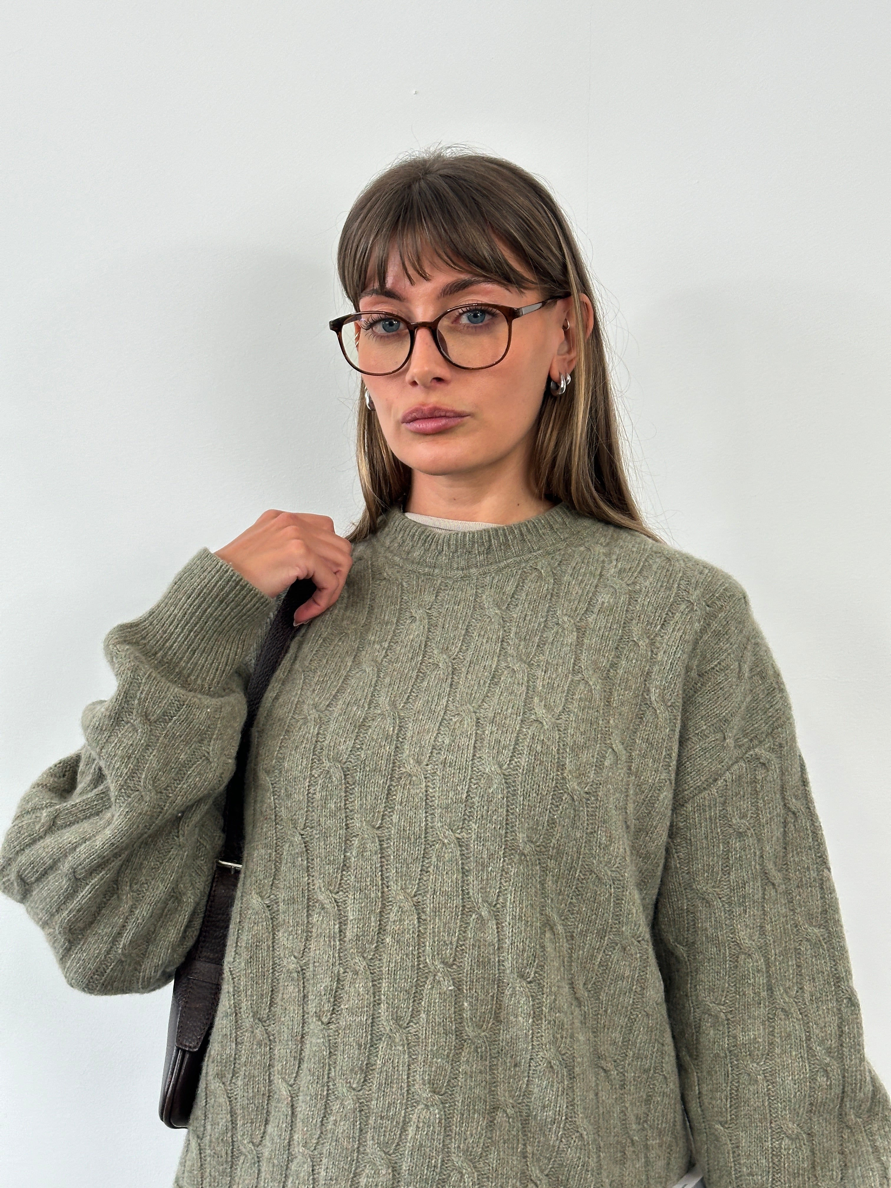 Vintage Italian 1990s wool knitted jumper in XL, featuring a cozy textured knit and classic design.