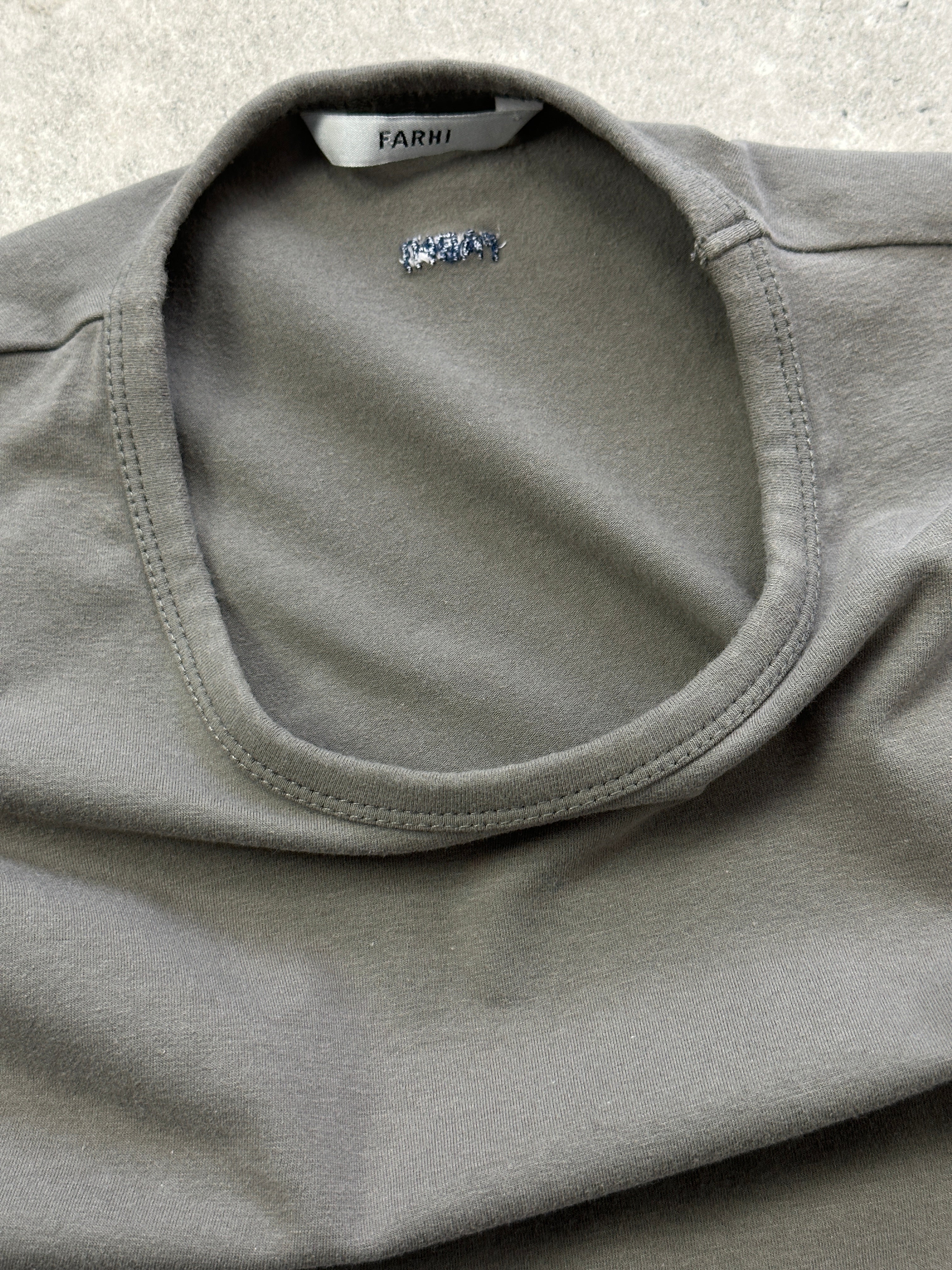 Nicole Farhi cotton long sleeve T-shirt in size M/L, shown in a natural pose, highlighting the soft fabric and classic fit.