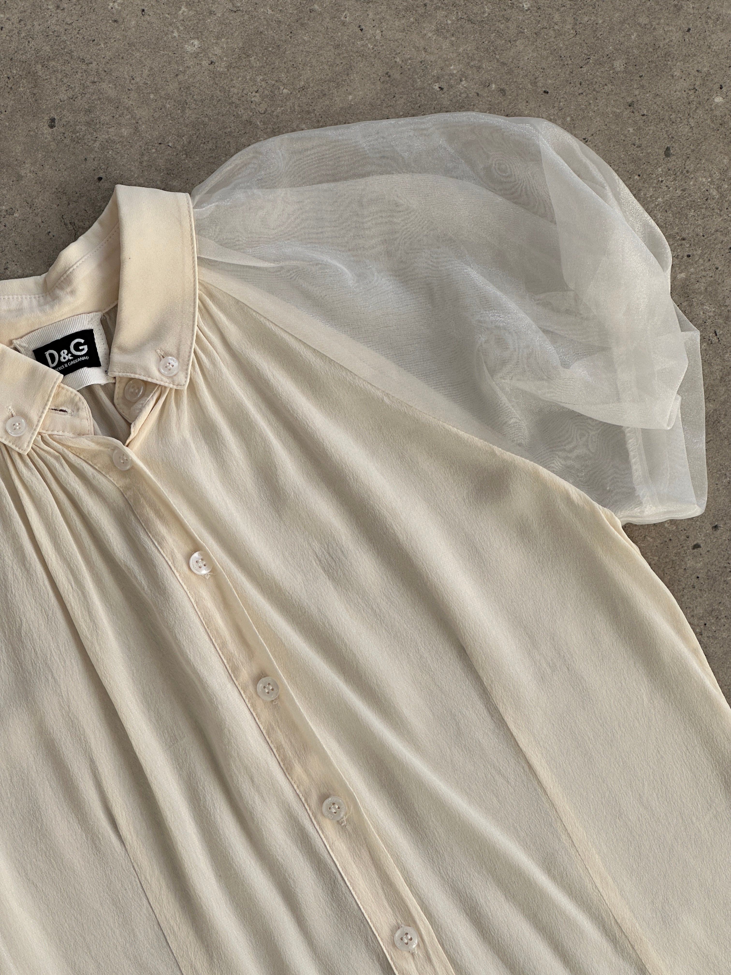 Dolce & Gabbana pure silk puff sleeve shirt in XS/S, featuring elegant design and lightweight fabric, shown on a mannequin.