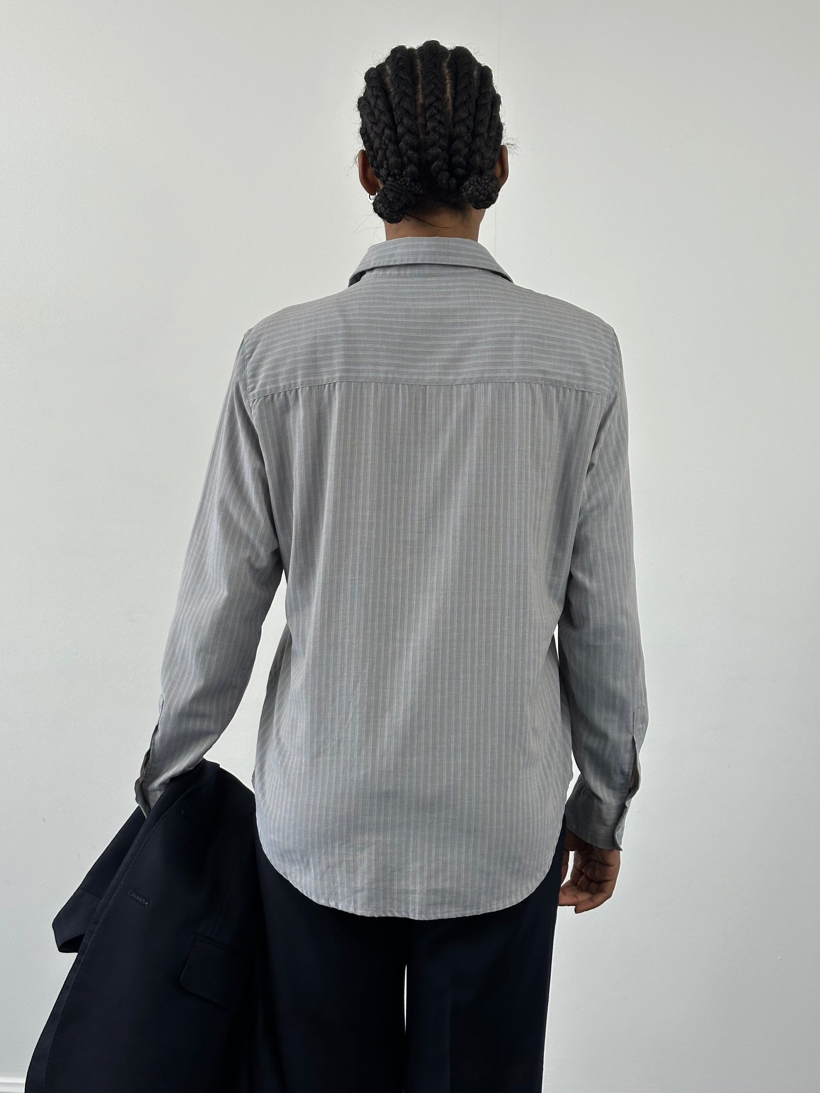 Armani Jeans 2000s stripe logo shirt in size M, featuring bold stripe patterns and the classic Armani branding on the front.