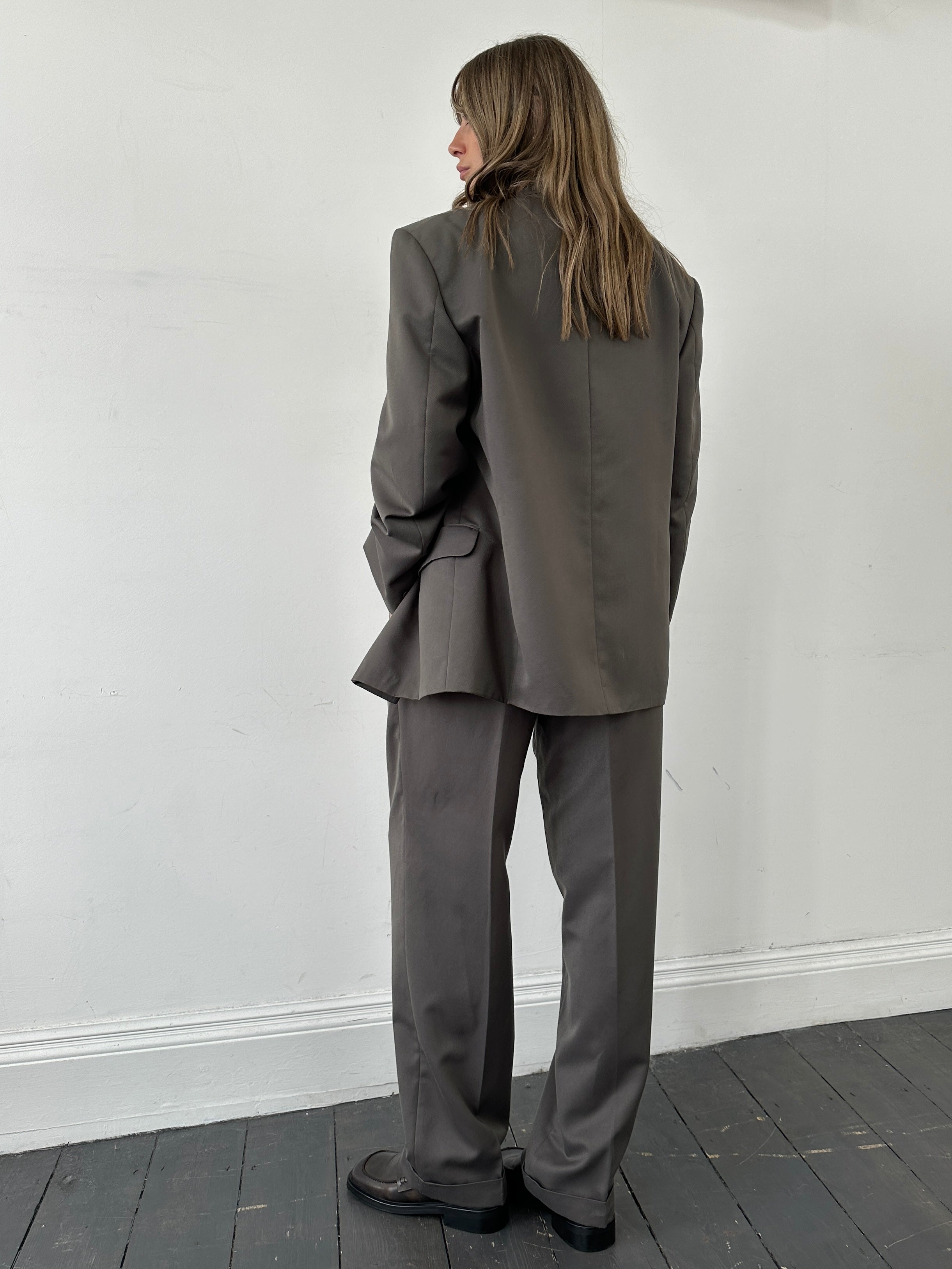 Vintage British vintage double-breasted jumpsuit in size 40R/W32, featuring classic tailored design and vintage fabric.