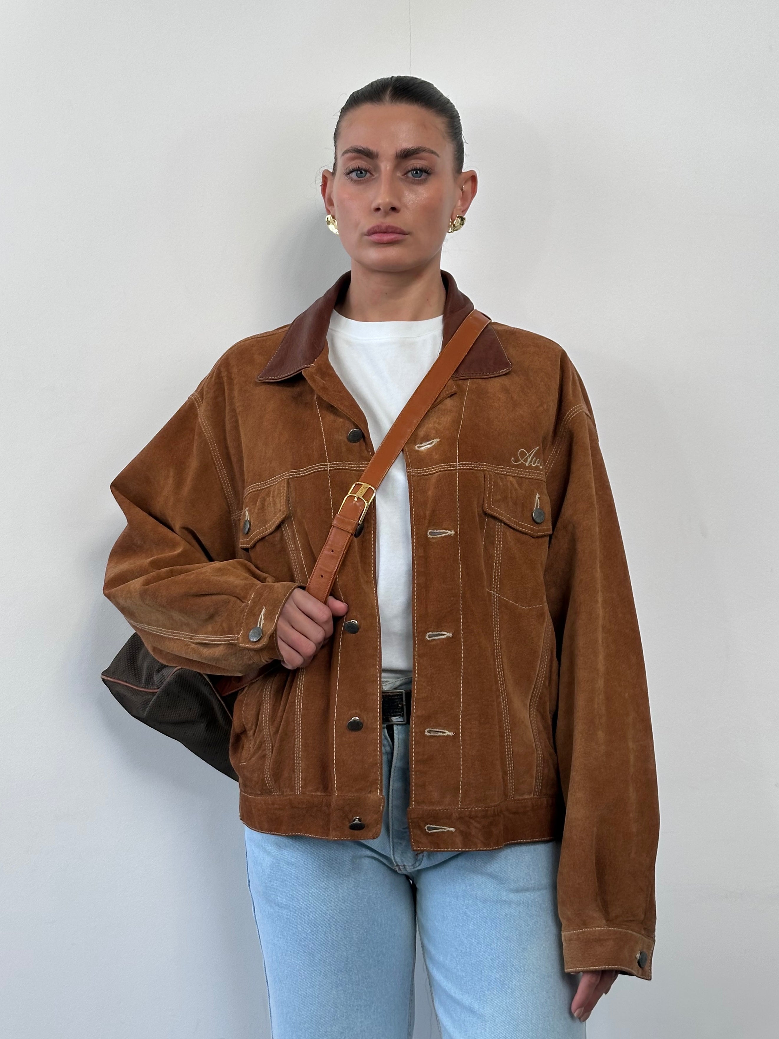 Avirex suede trucker jacket in size large, featuring a classic design with a soft suede finish and traditional trucker style.