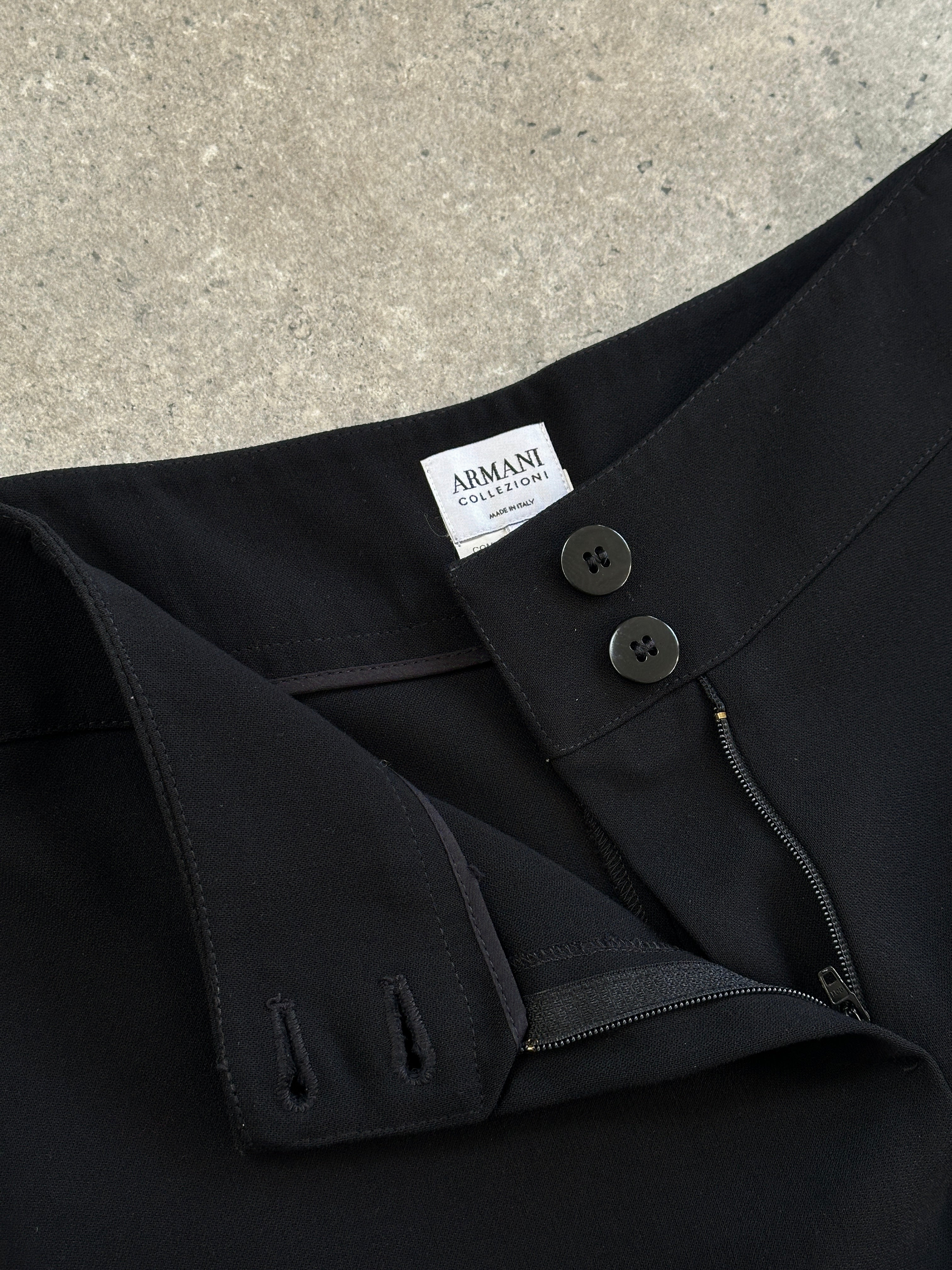 Armani Collezioni wool low waist wide-leg trousers in size W26, shown laid flat with front view and tailored details.