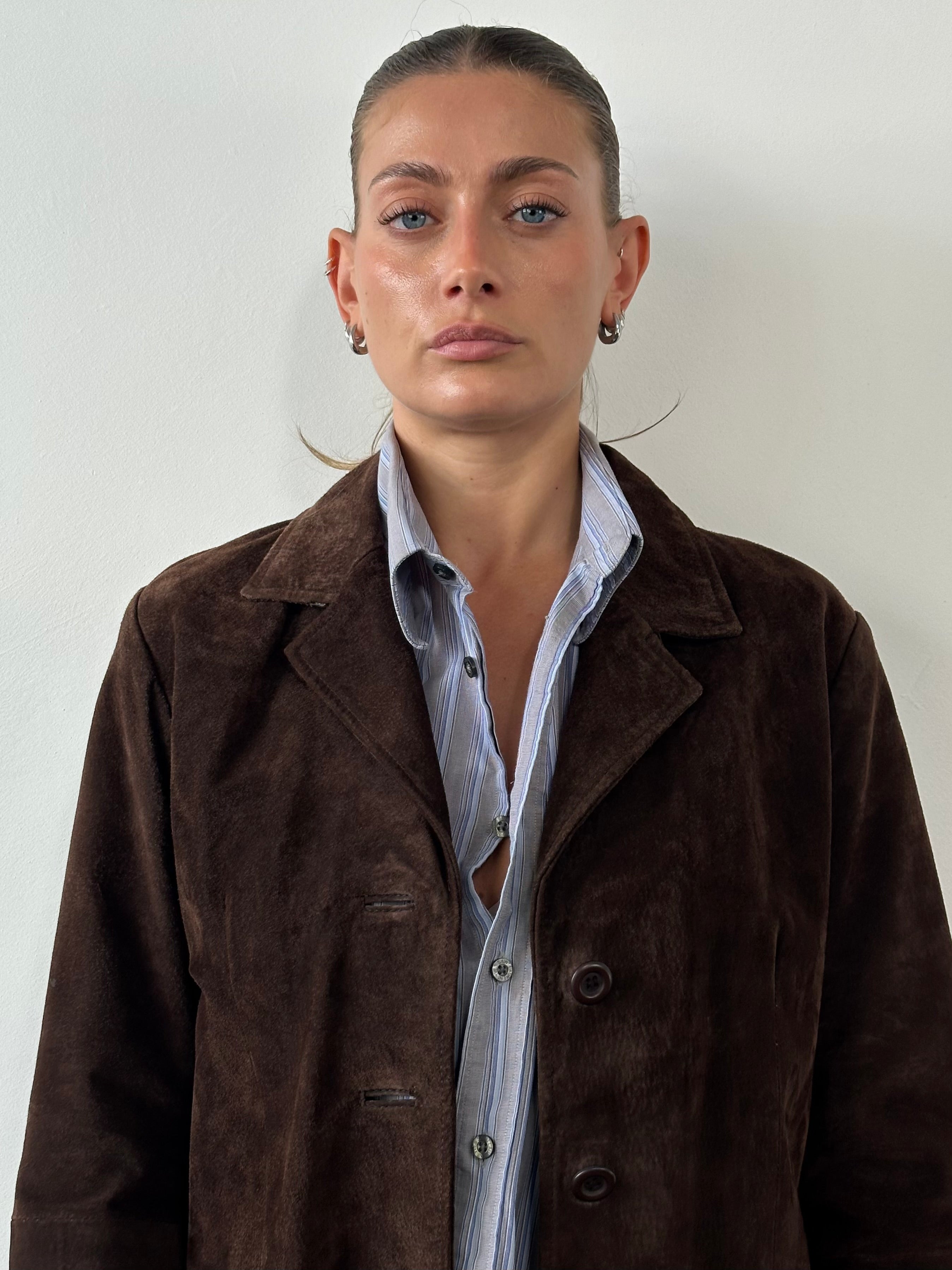 Vintage suede trench coat jacket in size large, stylish and classic with a timeless design and soft suede texture.