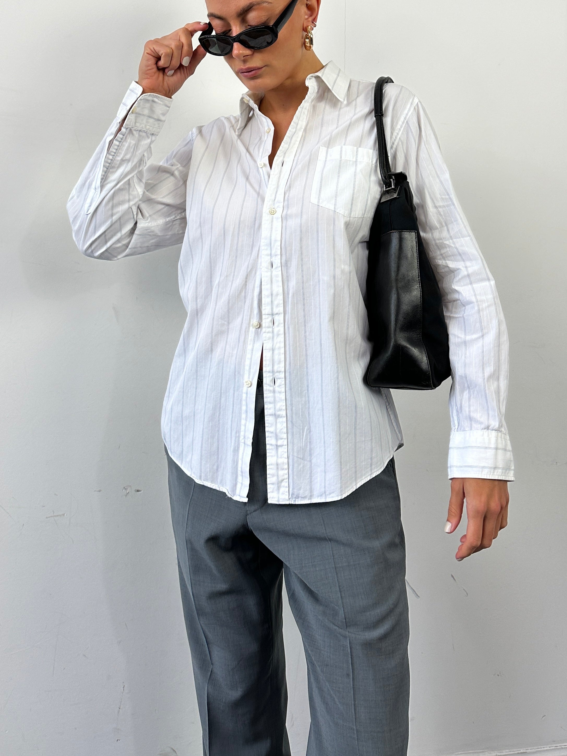 Gucci 1990s Tom Ford canvas and leather hobo shoulder bag with a slouchy design and adjustable strap.