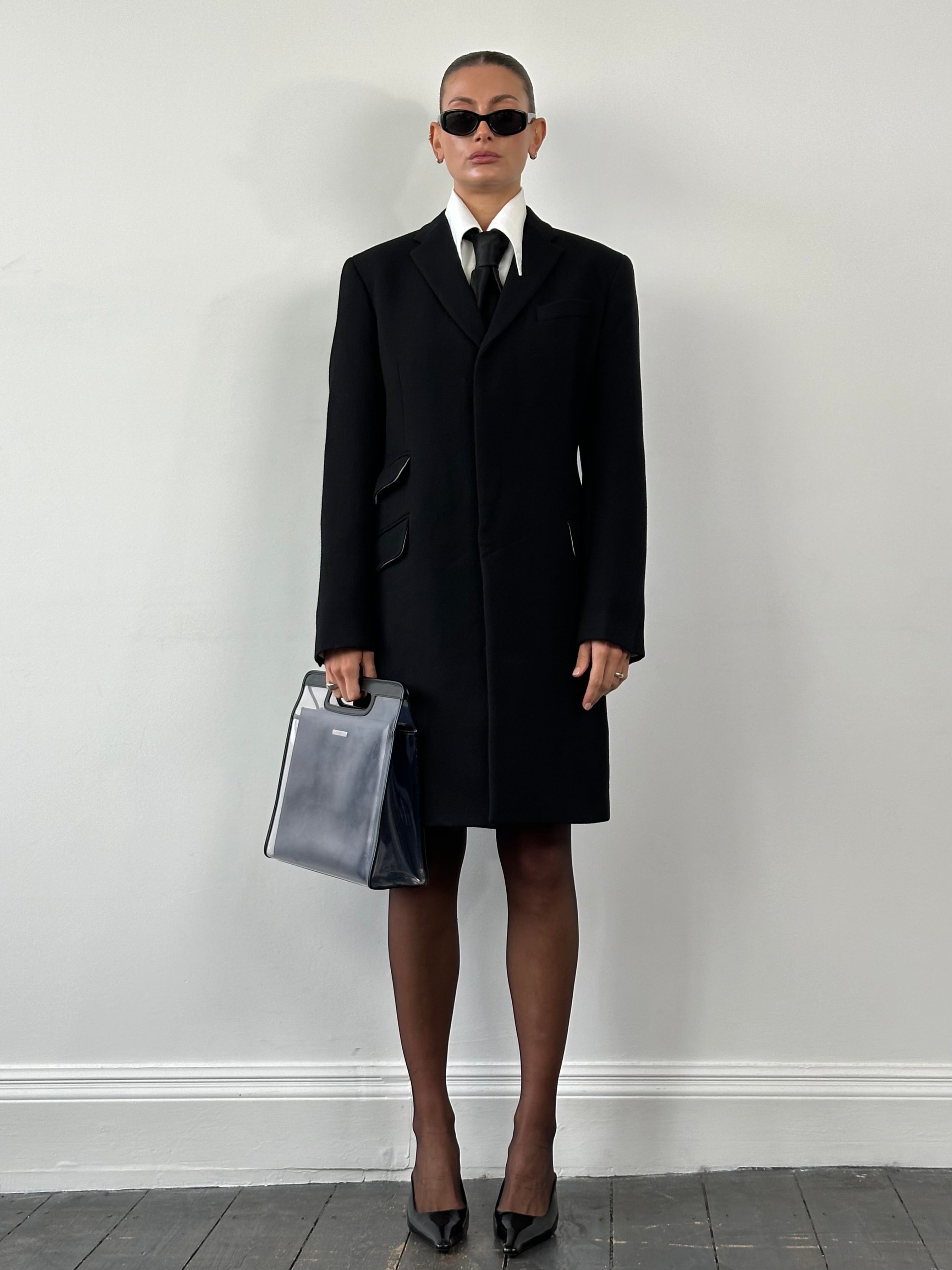 Dolce & Gabbana pure wool single-breasted coat in size M, stylish and tailored with classic lapel collar and button closure.