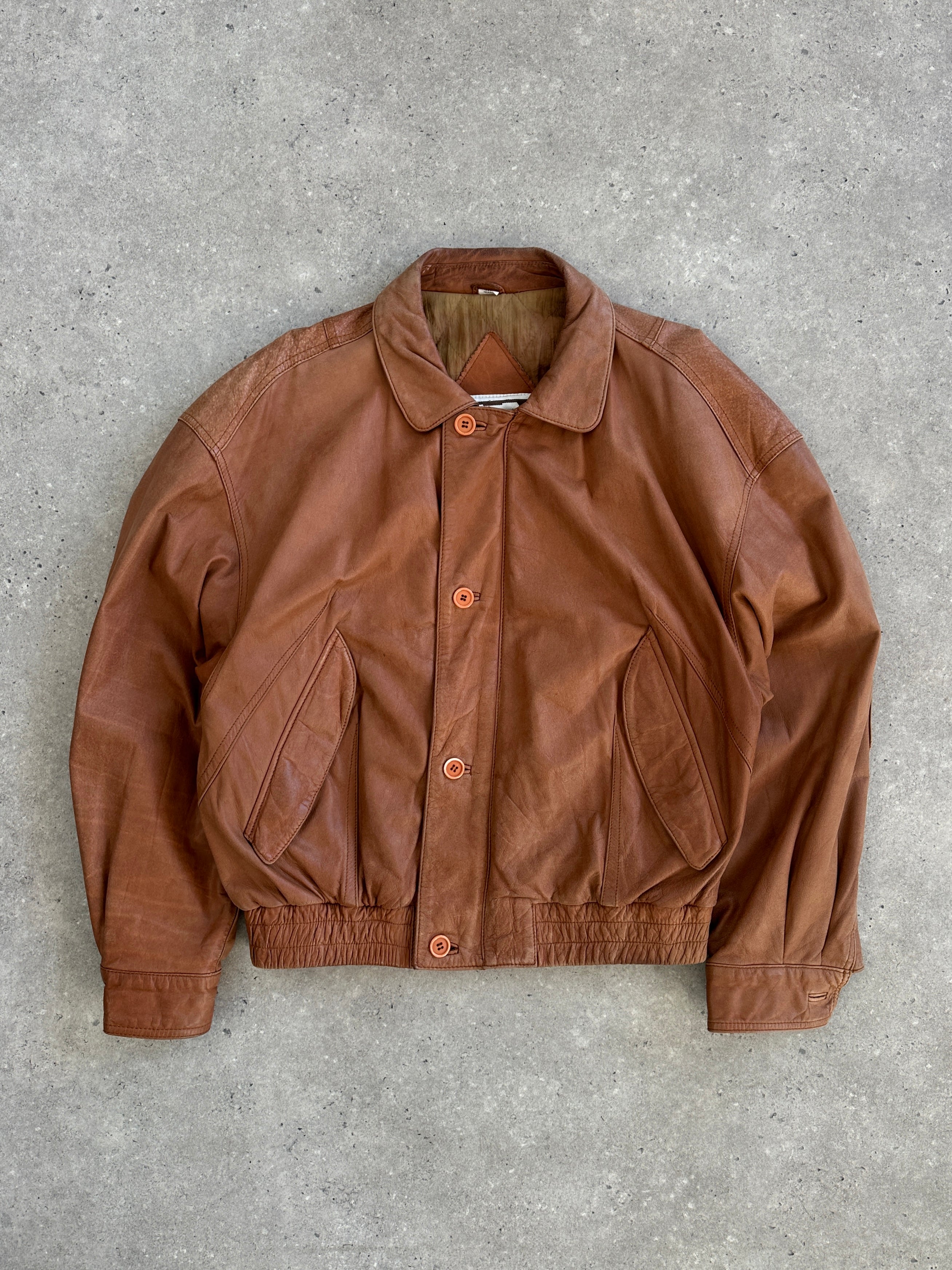 Vintage 1980s leather bomber jacket, men's size L, with classic design and distressed leather finish.