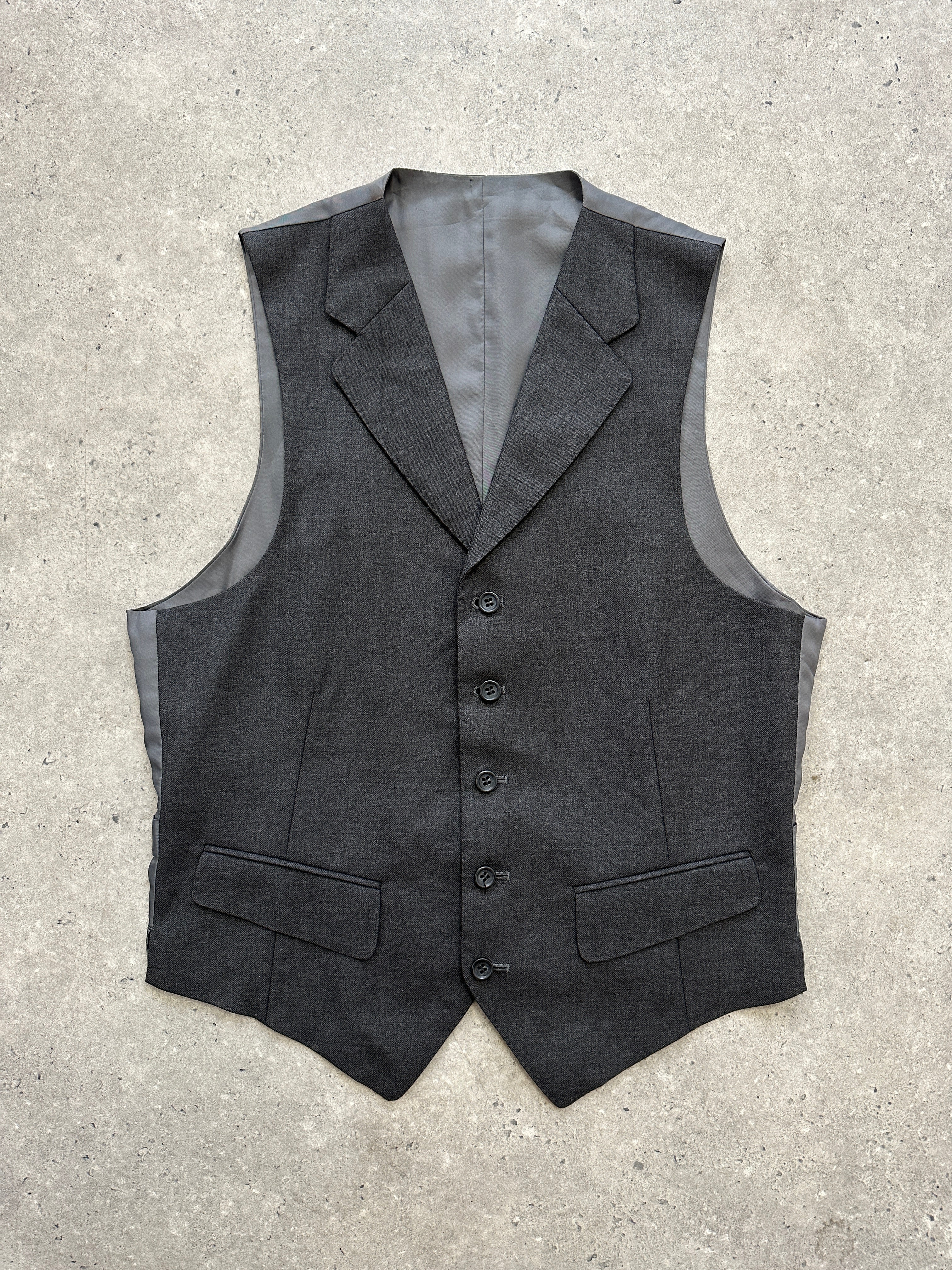 Vintage brand vintage wool waistcoat with a collared style, displayed as a classic coat in a natural fabric finish.