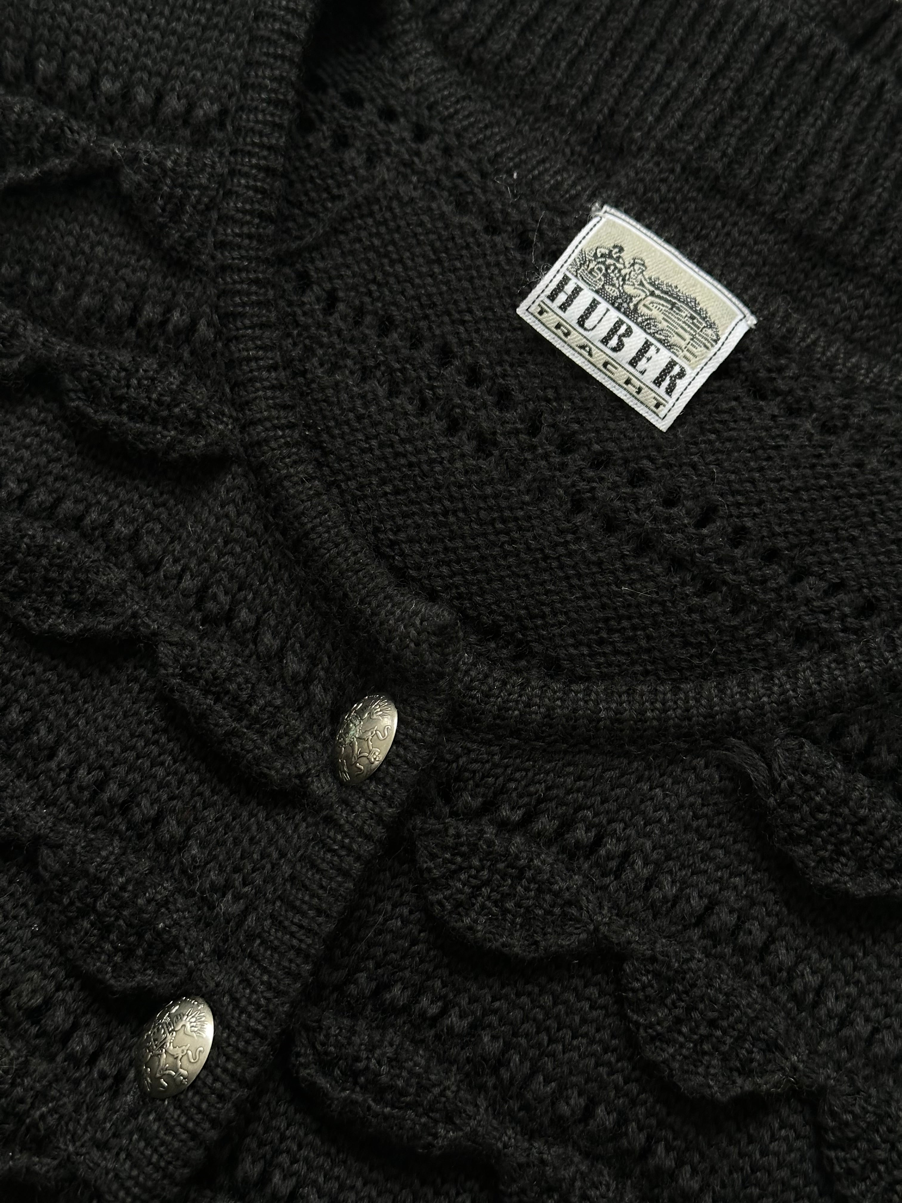 Vintage 1990s pure wool knitted cardigan in size M, featuring classic design and cozy texture.