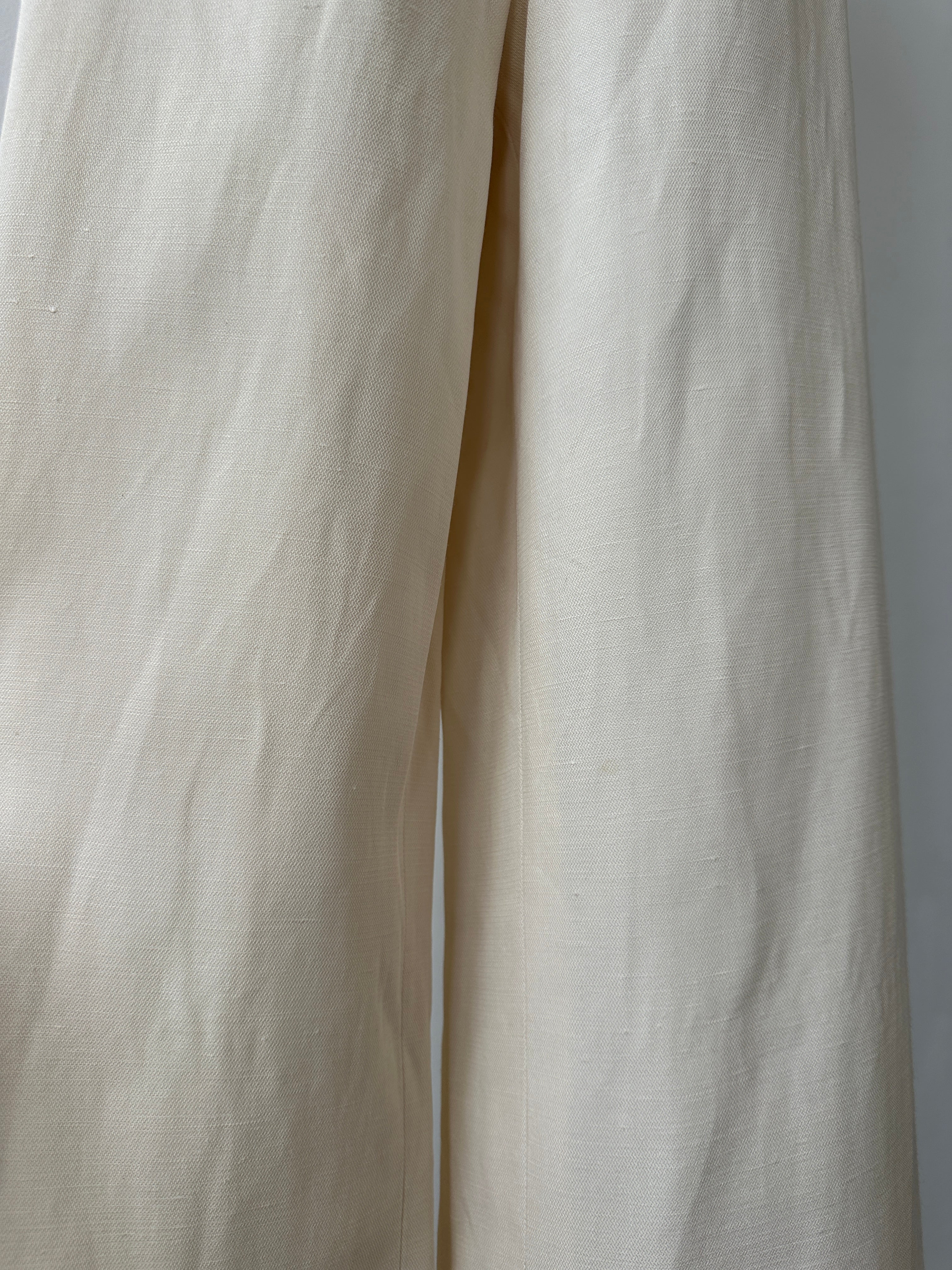 Giorgio Armani 1990s wide leg tailored trousers in dark fabric, high waist, with front pleats and classic tailored style.