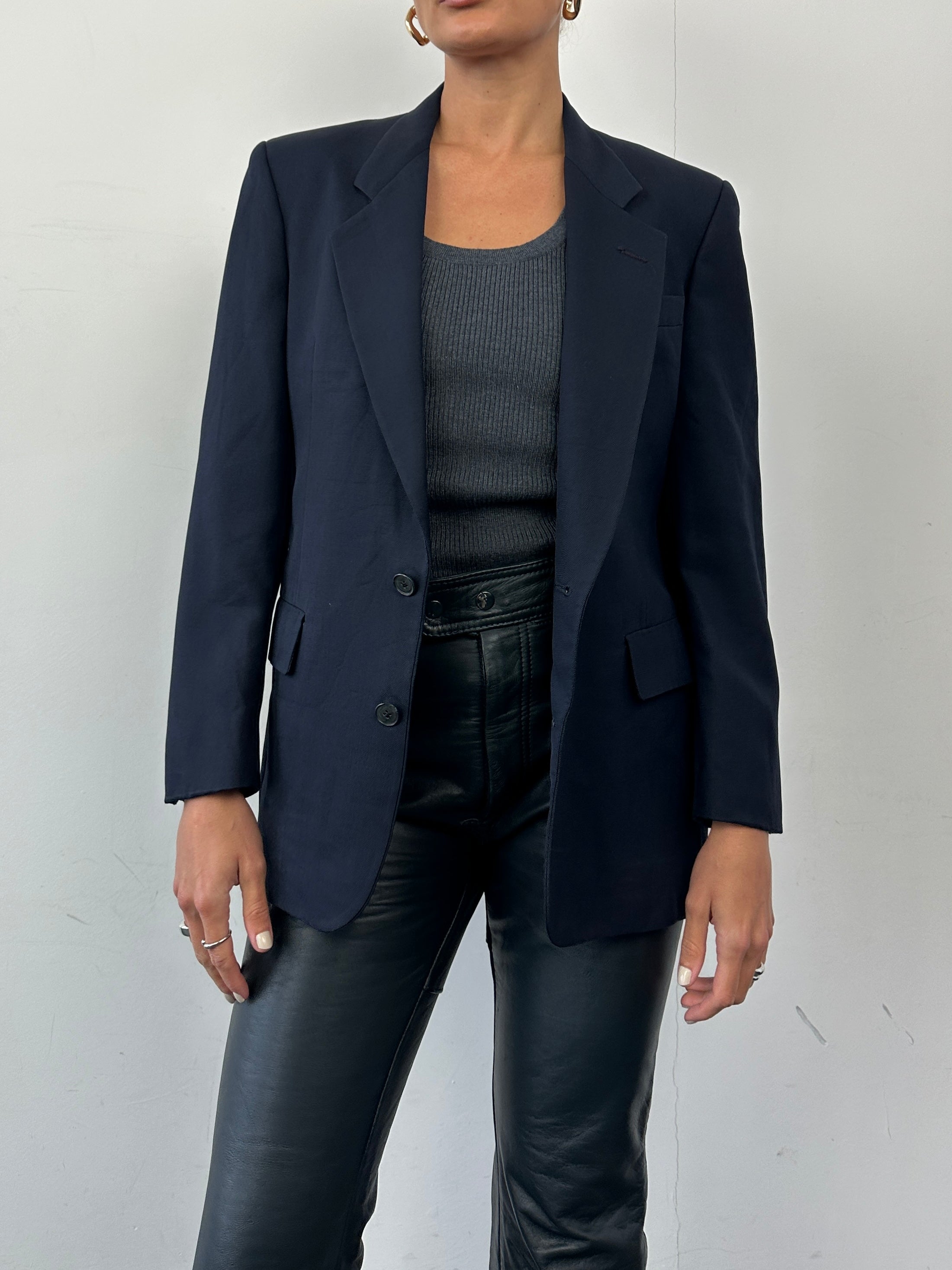 Christian Dior wool single-breasted blazer in XS/S size, tailored fit, classic design with lapel collar and button closure.