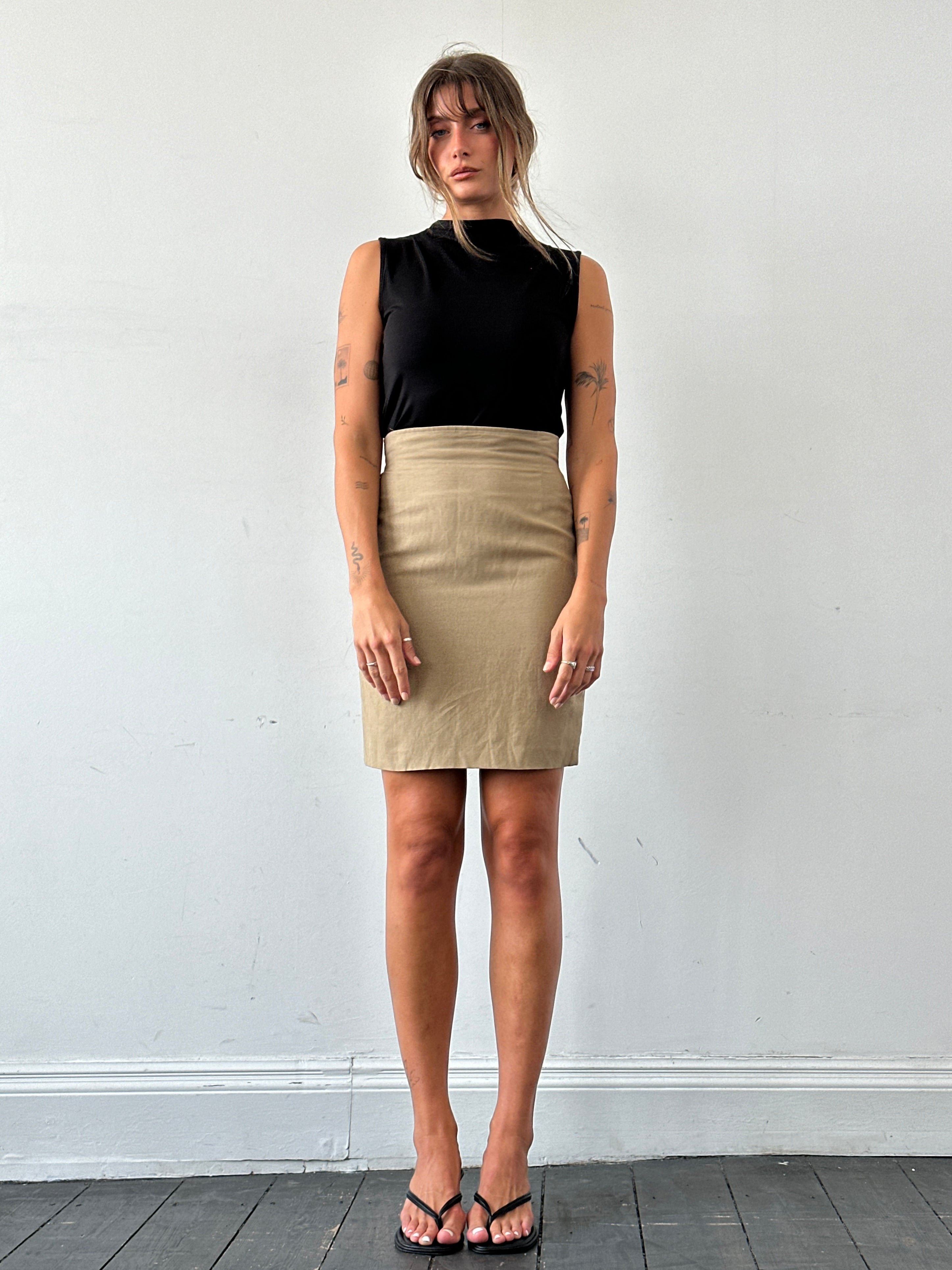 Marella linen mini skirt in W26, shown in natural beige fabric, styled with a casual summer look.