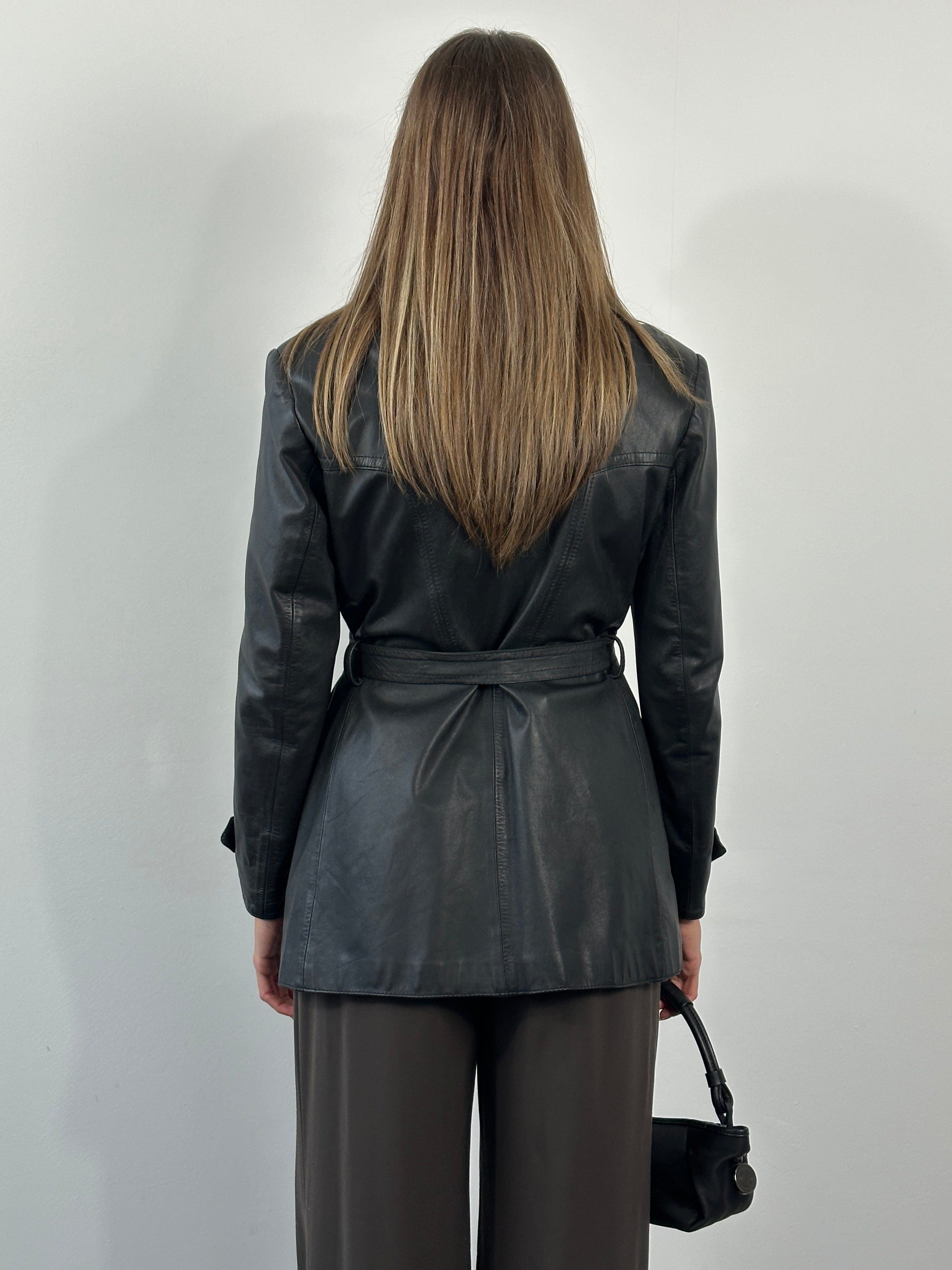 Vintage 1990s belted leather jacket, size M, classic leather jacket with belt and vintage style, displayed on a hanger.