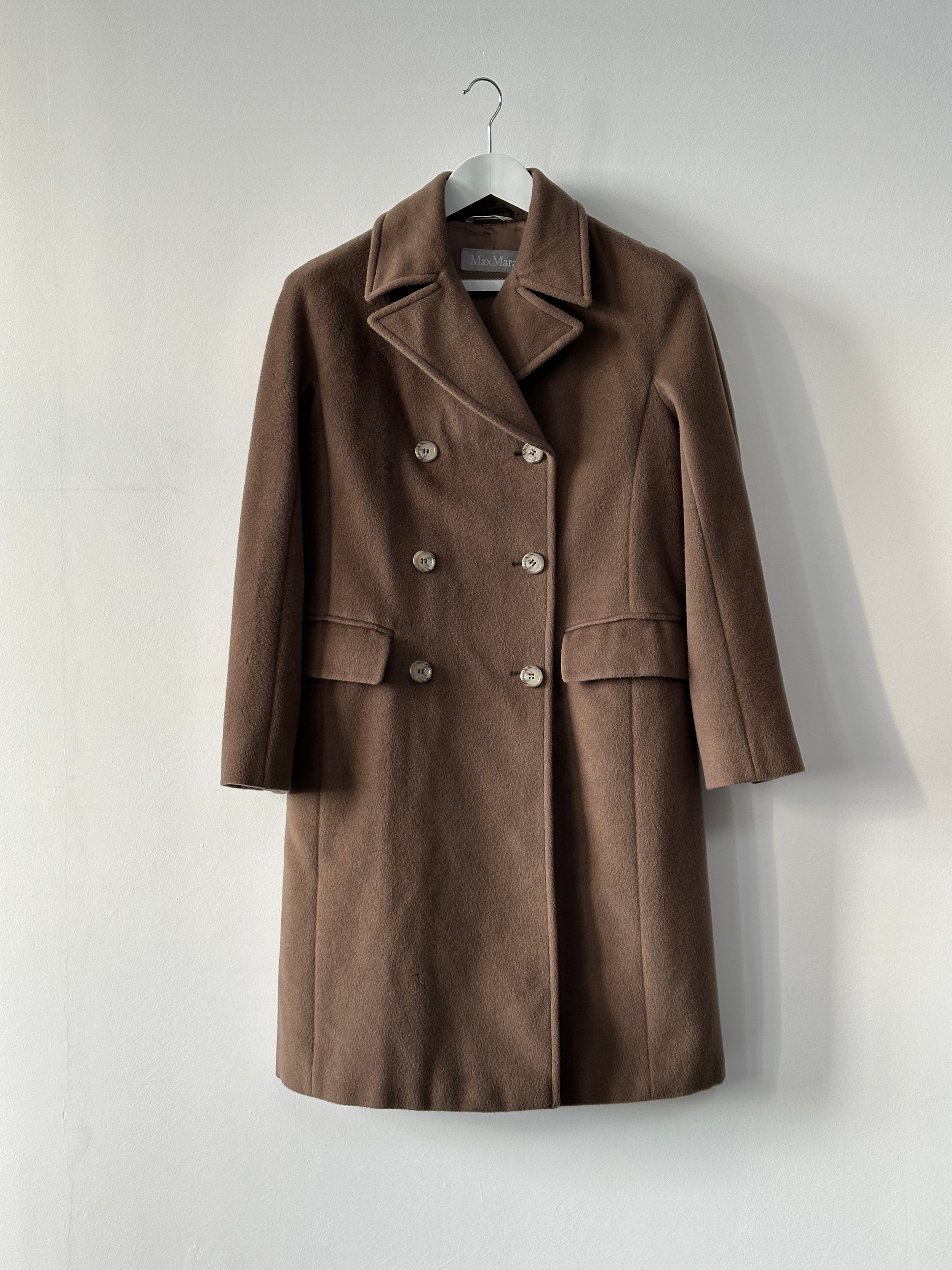 Max Mara pure wool double-breasted coat in size S, displayed on a hanger with classic tailored design and neutral color.